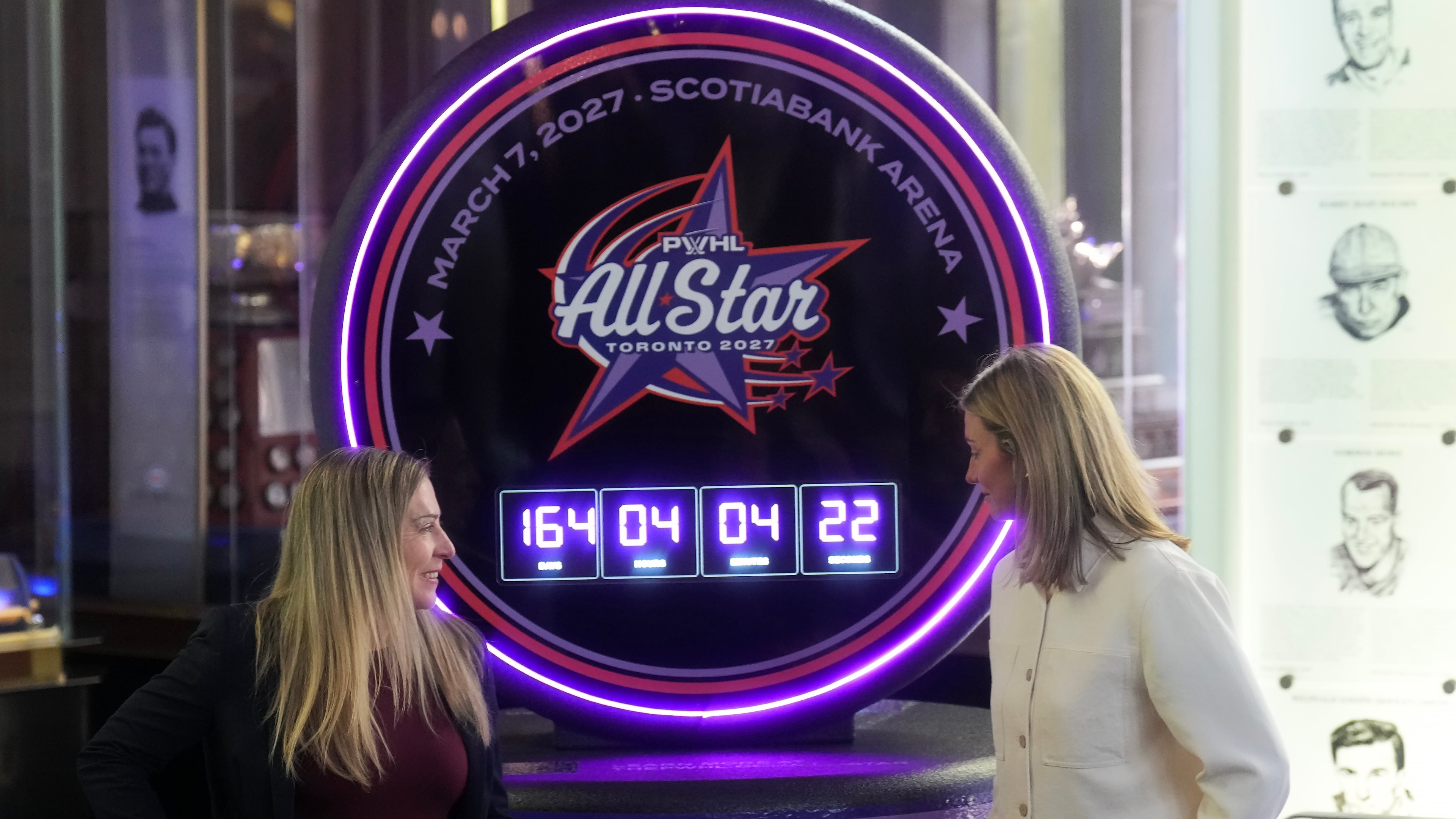 Jayna Hefford, left, Executive Vice President of Hockey Operations for the PWHL, and Laura Stacey, PWHL Players Association President talk as they announce the first ever PWHL All-Star Game, which will take place in Toronto next year, during a press conference in Toronto, Thursday, Sept. 24, 2026. (Nathan Denette/The Canadian Press via AP)