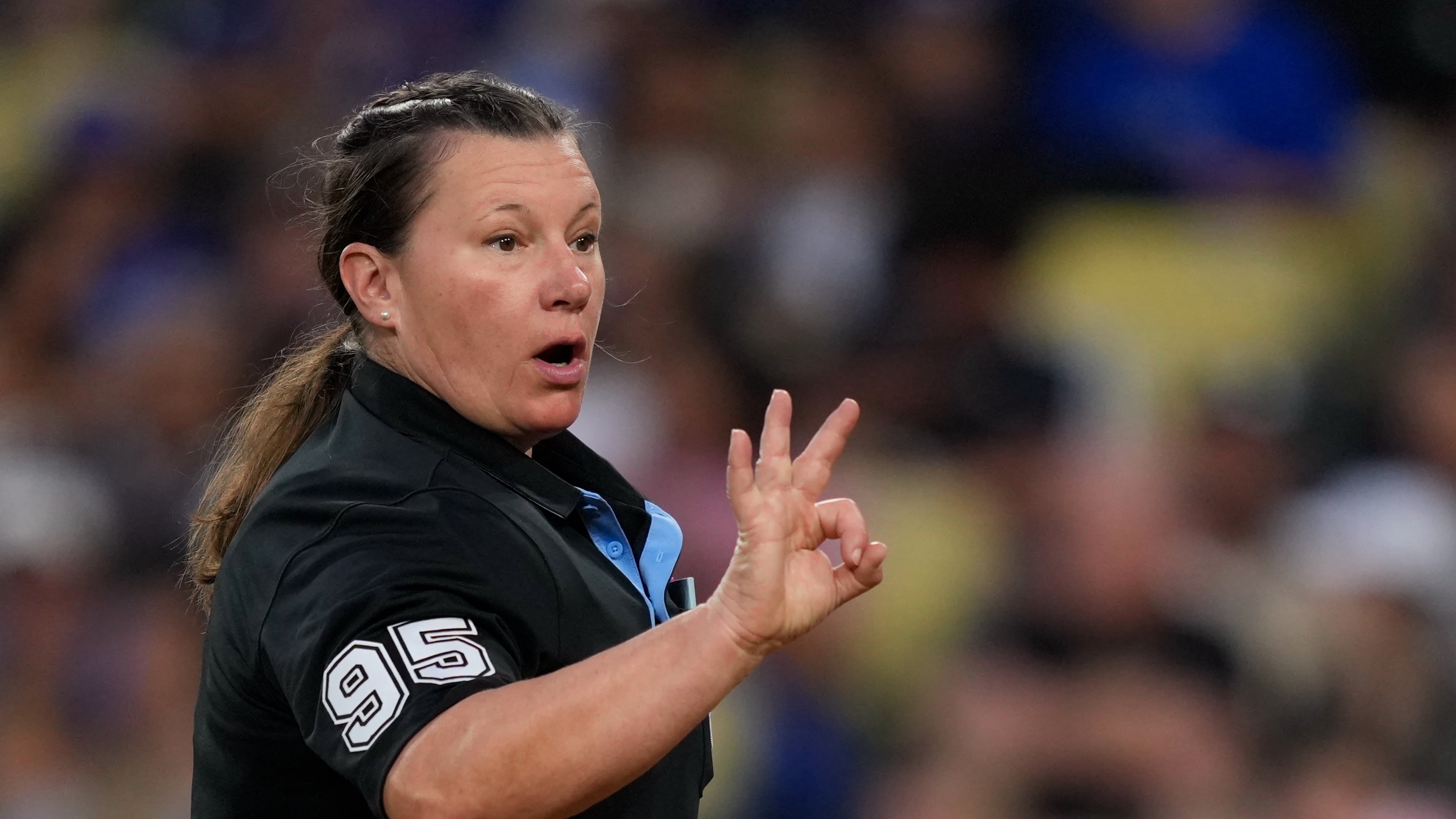 Home plate umpire Jen Pawol asks for more baseballs during the third inning of a baseball game between the Los Angeles Dodgers and the Los Angeles Angels, Friday, June 5, 2026, in Los Angeles. (AP Photo/Mark J. Terrill)
