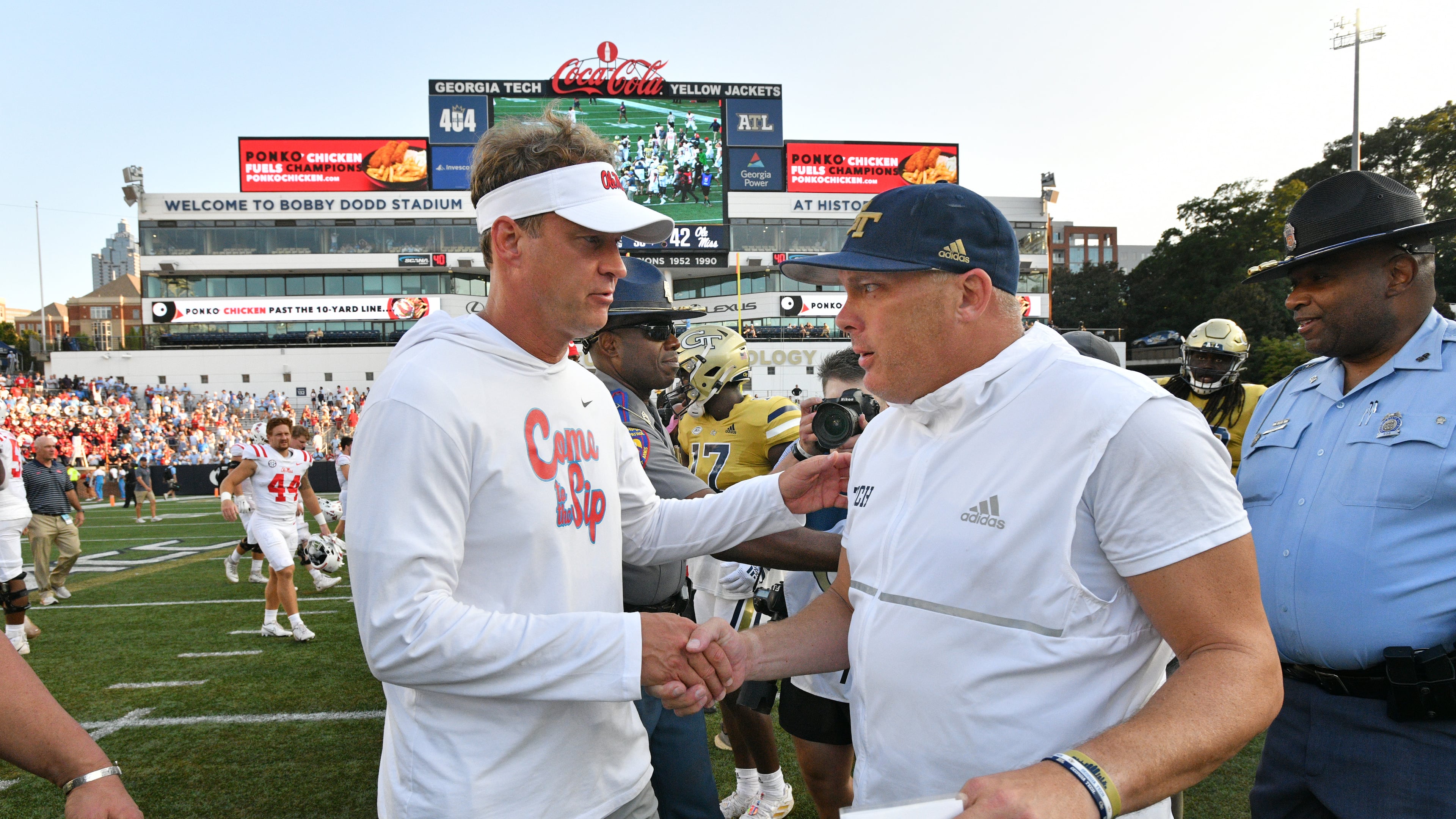 Ole Miss head coach Lane Kiffin and Georgia Tech's head coach Geoff Collins shake hands after the game. (Hyosub Shin / Hyosub.Shin@ajc.com)