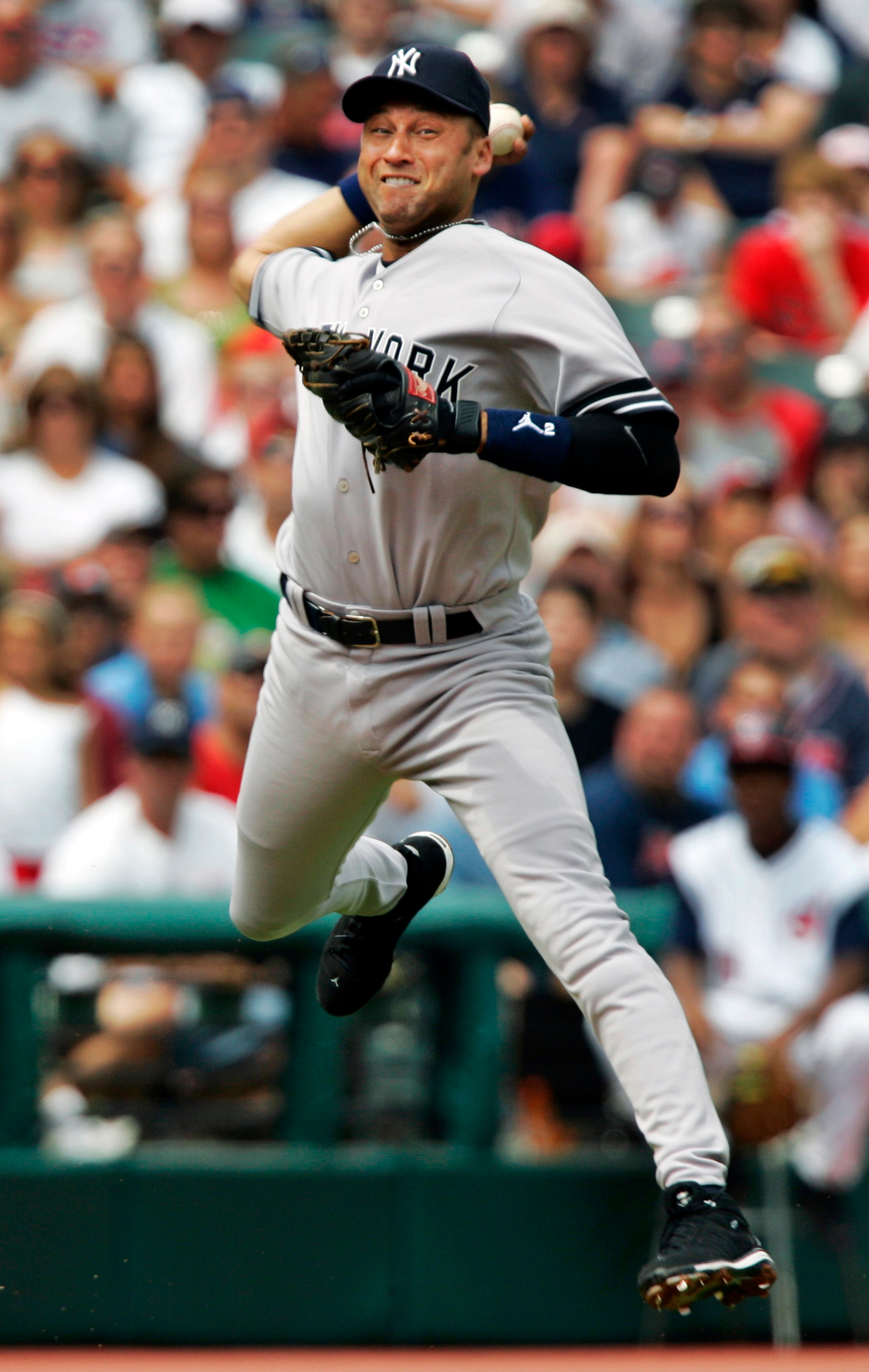 FILE - In this Aug. 12, 2007, file photo, New York Yankees shortstop Derek Jeter makes a leaping throw to get Cleveland Indians' Casey Blake at first base in the first inning of a baseball game in Cleveland. A five-time World Series champion and sixth on the career hits list, Jeter, now 40, is set to retire after this season after spending two decades as the shortstop for the Yankees. (AP Photo/Mark Duncan, File)