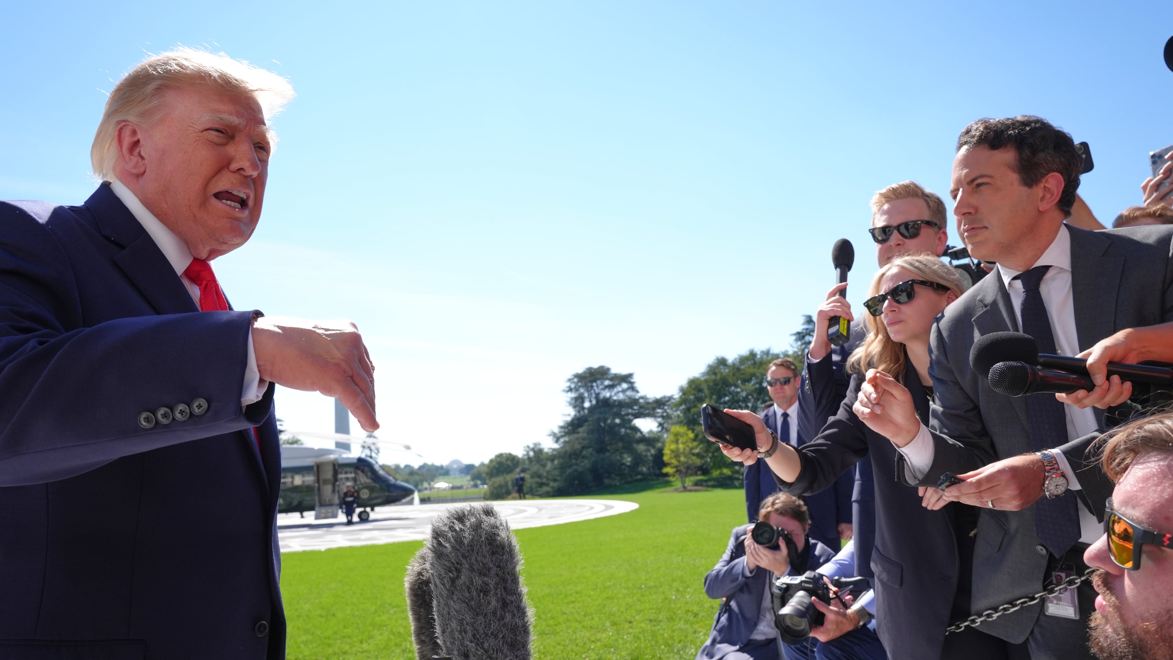 President Donald Trump speaks with reporters before boarding Marine One on the South Lawn of the White House, Thursday Oct. 1, 2026, in Washington. (AP Photo/Jacquelyn Martin)
