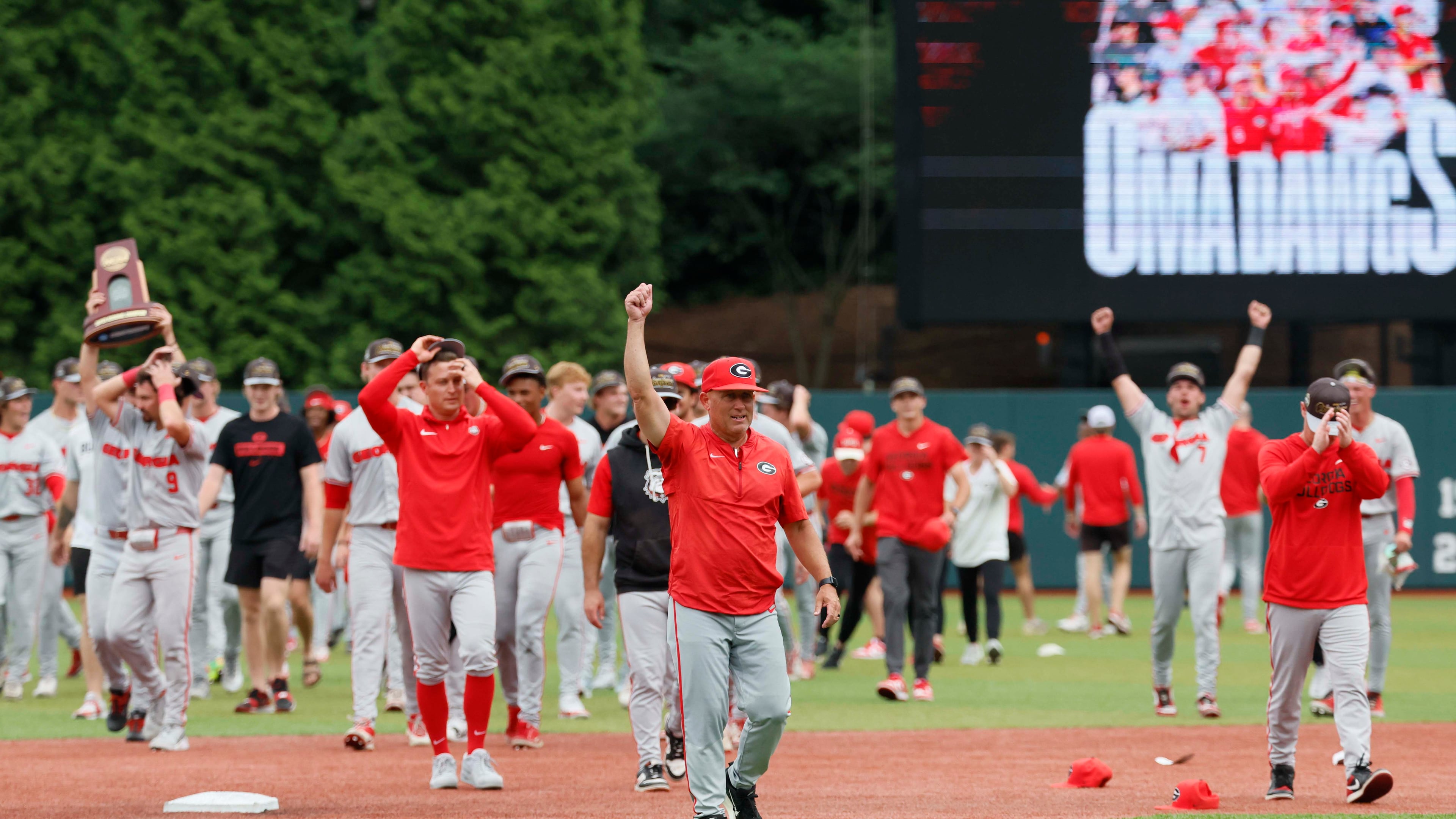 Georgia coach Wes Johnson (center) celebrates after UGA's super regional win over Mississippi State on Sunday, June 7, 2026, in Athens. Johnson has to replace many of players from the 2025 squad, which made the College World Series. (Miguel Martinez/AJC)