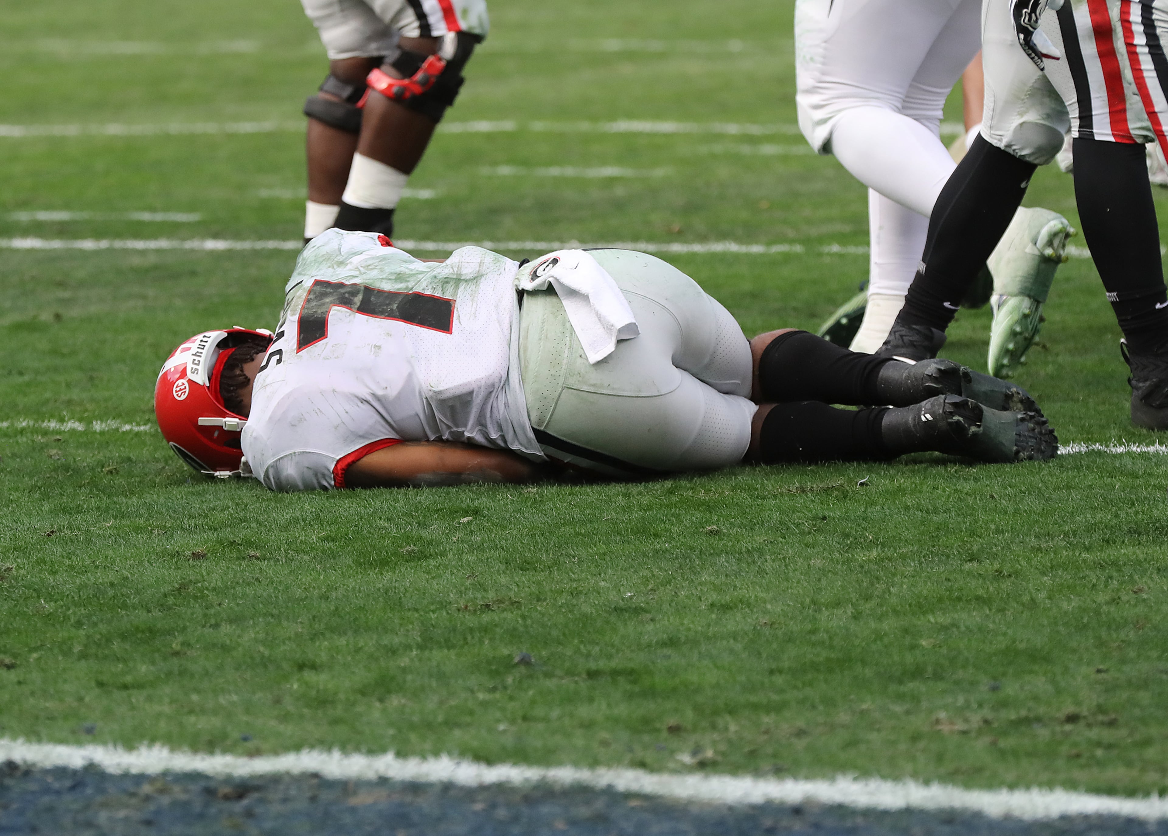 Georgia tailback D'Andre Swift lays on the turf injured after fumbling on a hit by Georgia Tech linebacker David Curry during the third quarter in a NCAA college football game on Saturday, November 30, 2019, in Atlanta. Georgia Tech recovered the fumble. Curtis Compton/ccompton@ajc.com