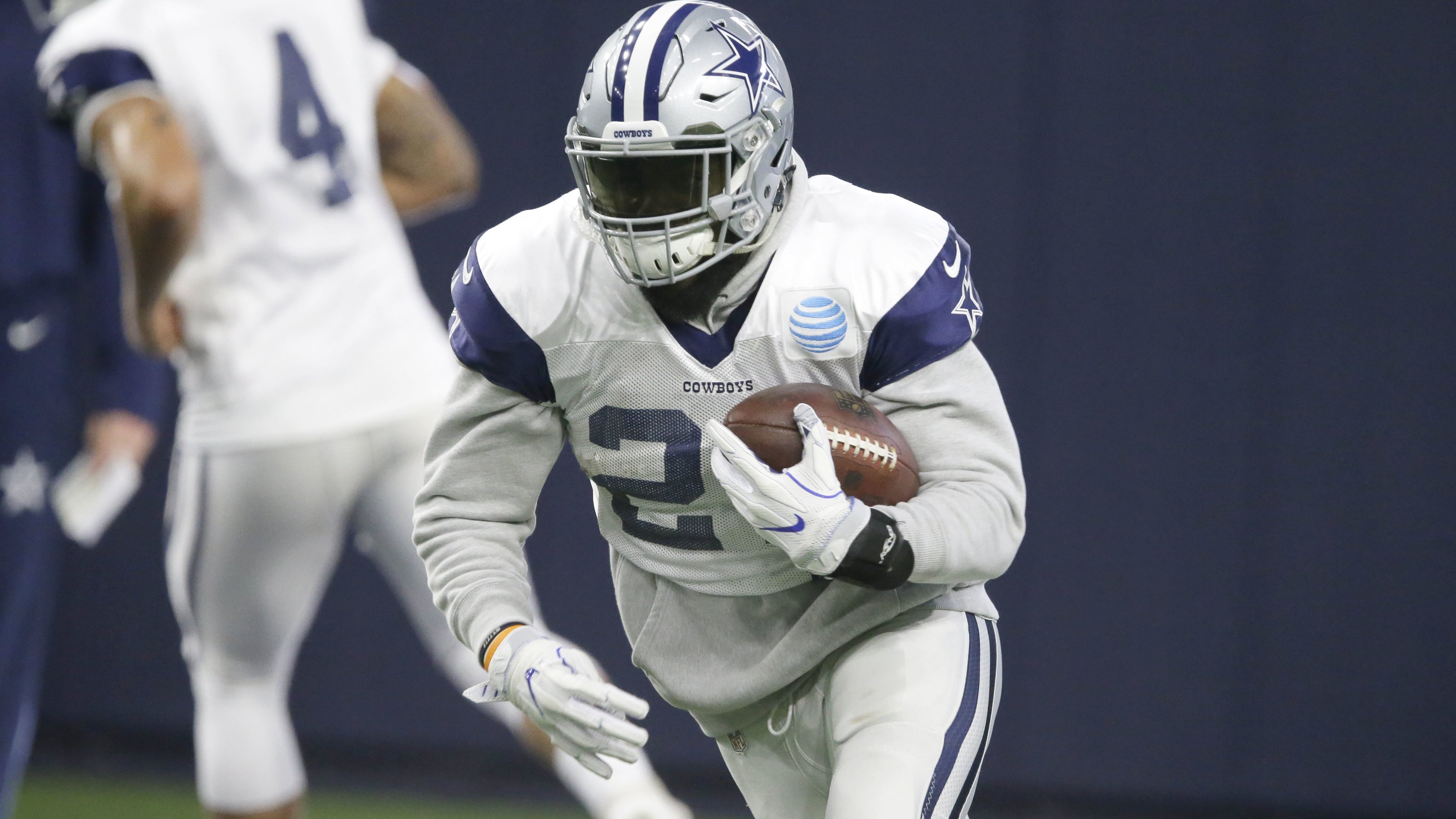 Dallas Cowboys running back Ezekiel Elliott (21) runs a drill during an indoor NFL football practice at the team's headquarters in Frisco, Texas, Wednesday, Jan. 11, 2017. (AP Photo/LM Otero)