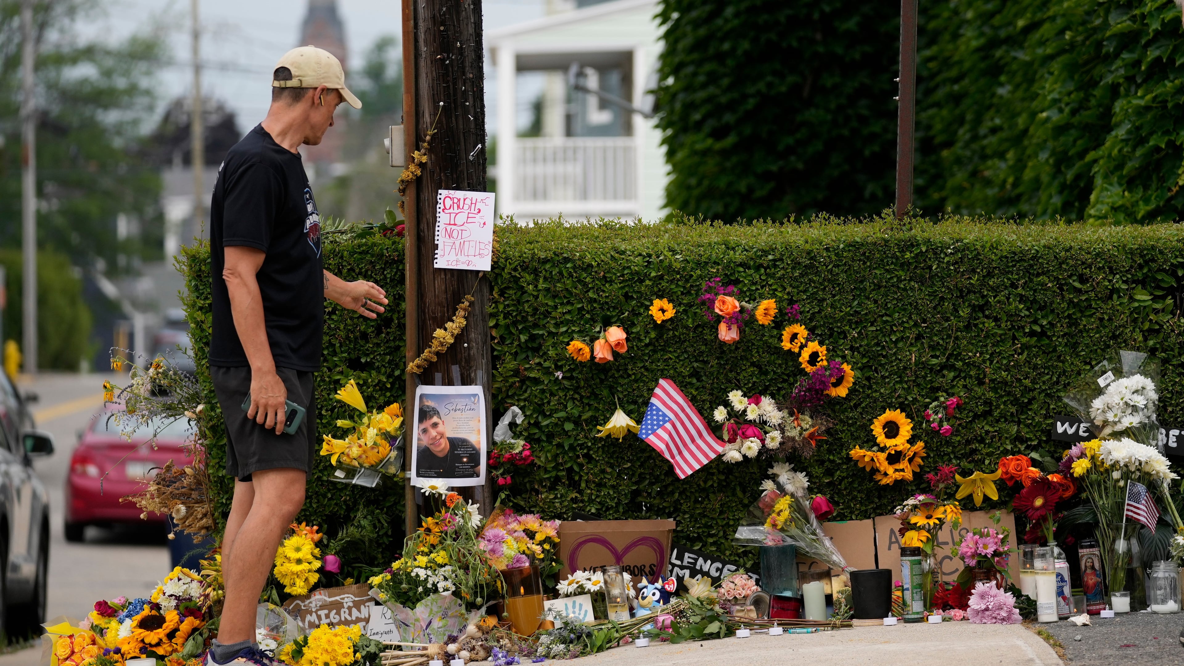 A man pauses to view a makeshift memorial to the victim of a shooting involving U.S. Immigration and Customs Enforcement, Tuesday, July 14, 2026 in Biddeford, Maine. (AP Photo/Robert F. Bukaty)