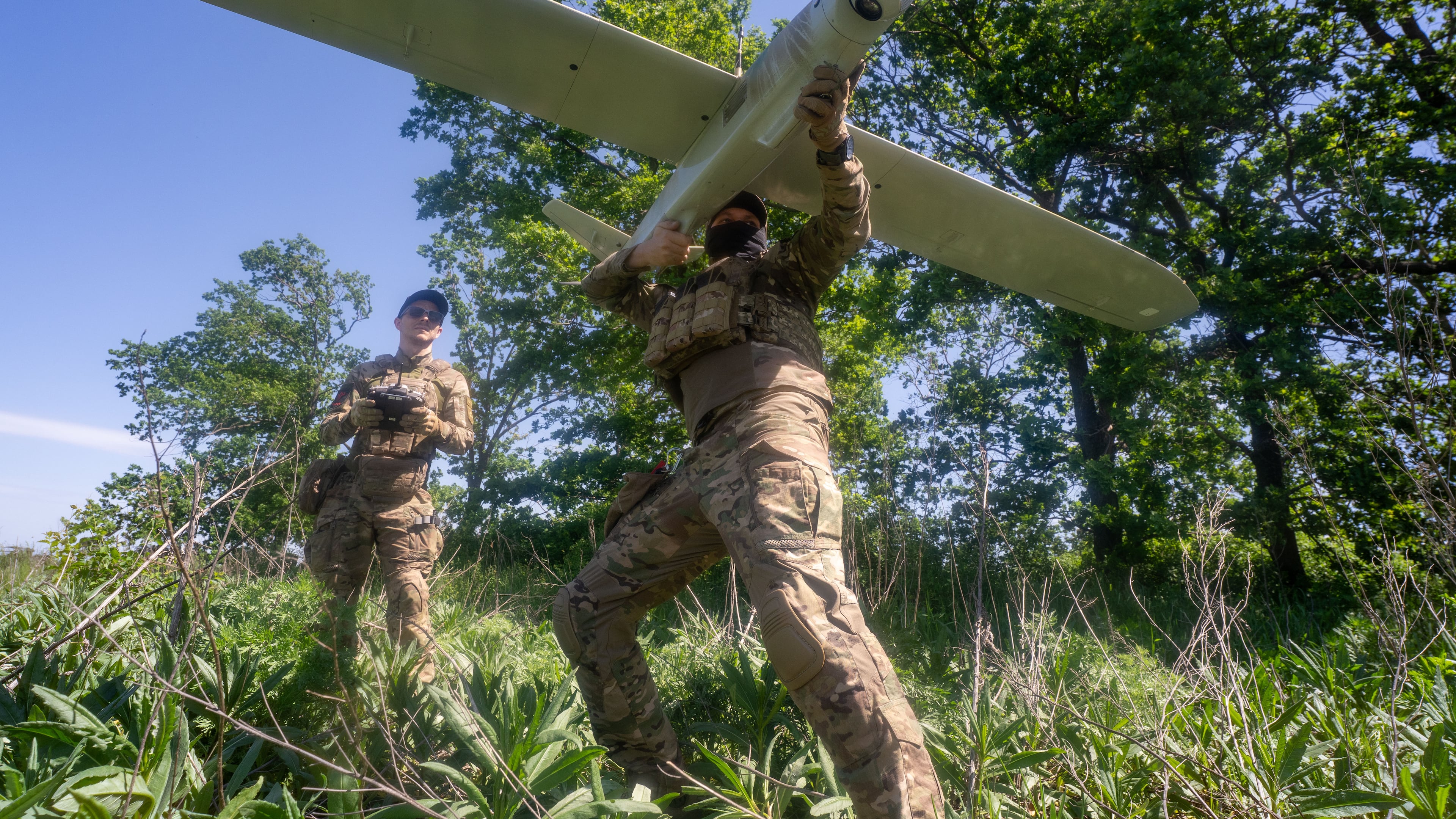 Ukrainian servicemen of Khartia brigade launch a drone towards Russian positions at the front line in the Kharkiv region, Ukraine, Wednesday, May 20, 2026. (AP Photo/Andrii Marienko)