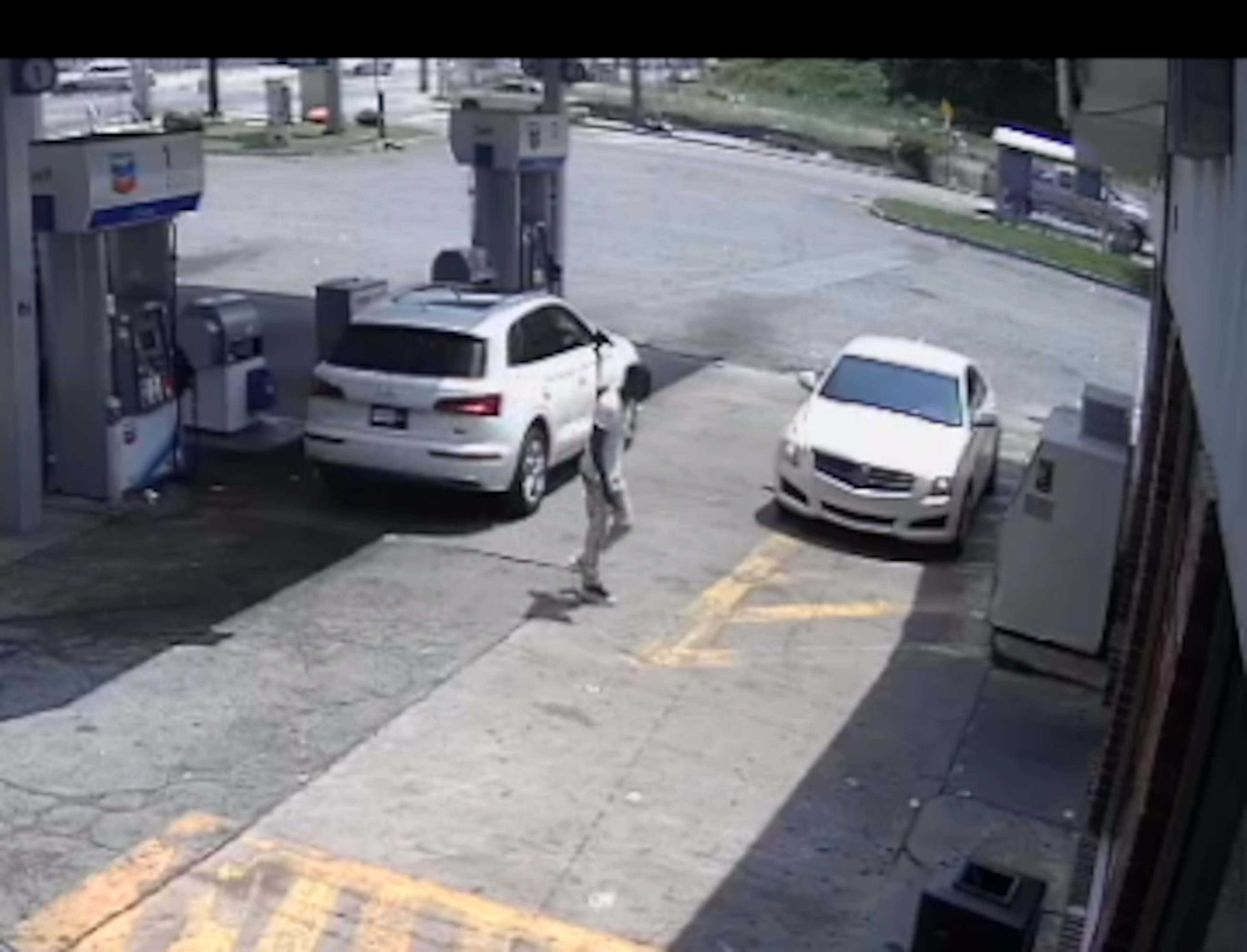 A security camera photo of the man suspected in a shooting that injured a man walking down the street on Aug. 10, 2021.