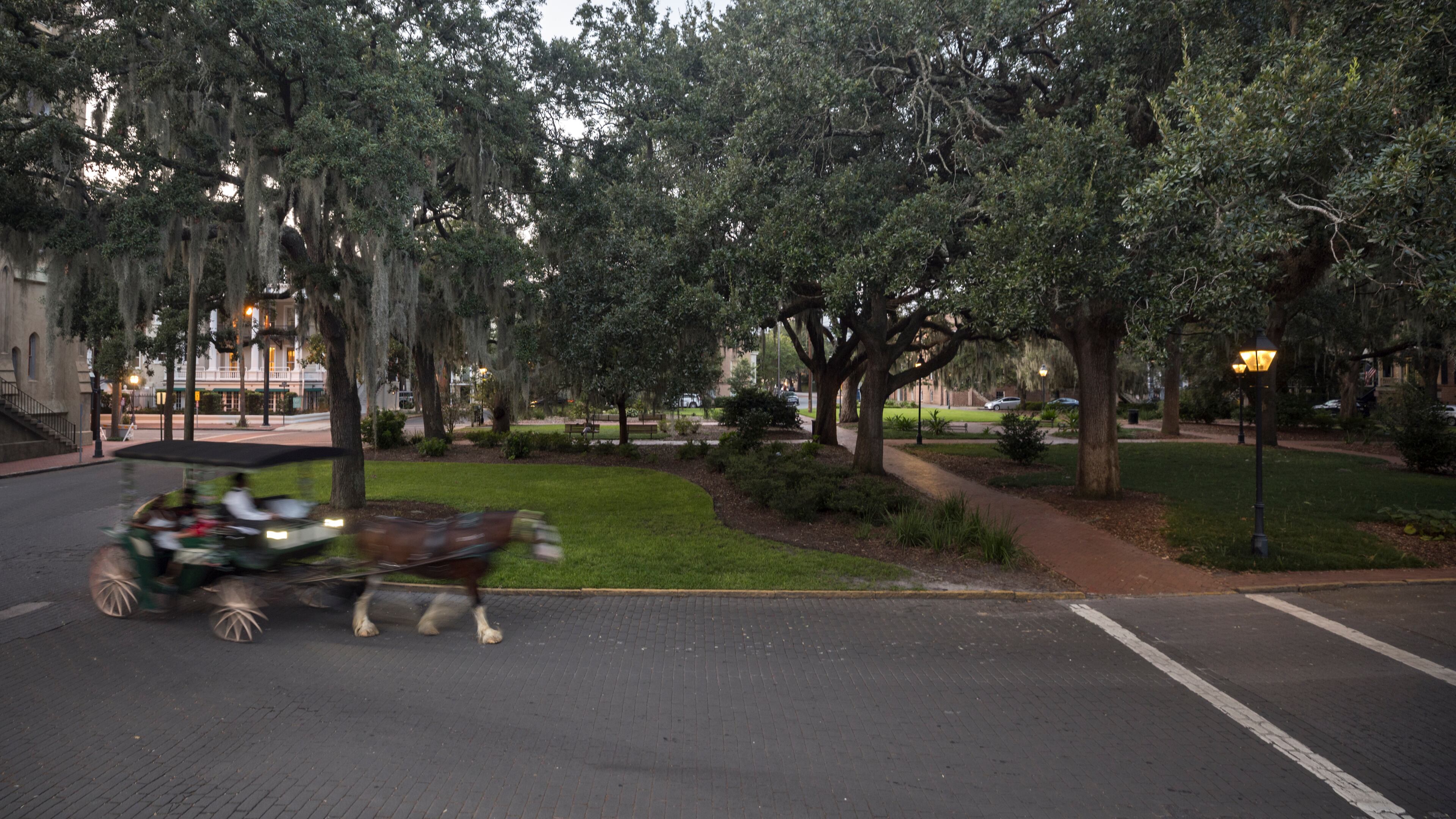 A horse-drawn carriage rounds Taylor Square, formerly Calhoun Square, in 2023. (Stephen B. Morton for the AJC)