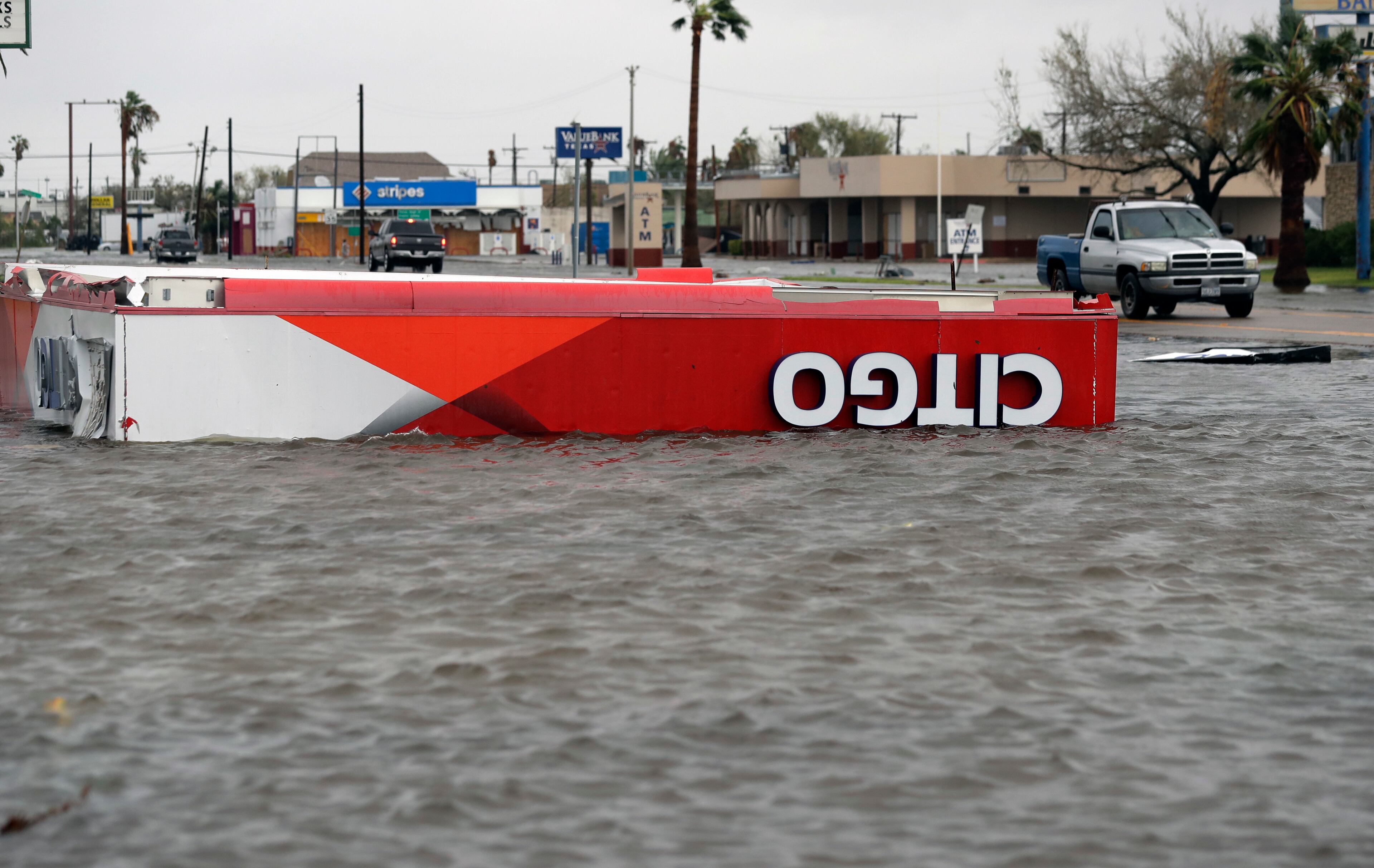 The roof of a gas station sits in flood waters in the wake of Hurricane Harvey, Saturday, Aug. 26, 2017, in Aransas Pass, Texas. Harvey rolled over the Texas Gulf Coast on Saturday, smashing homes and businesses and lashing the shore with wind and rain so intense that drivers were forced off the road because they could not see in front of them. (AP Photo/Eric Gay)