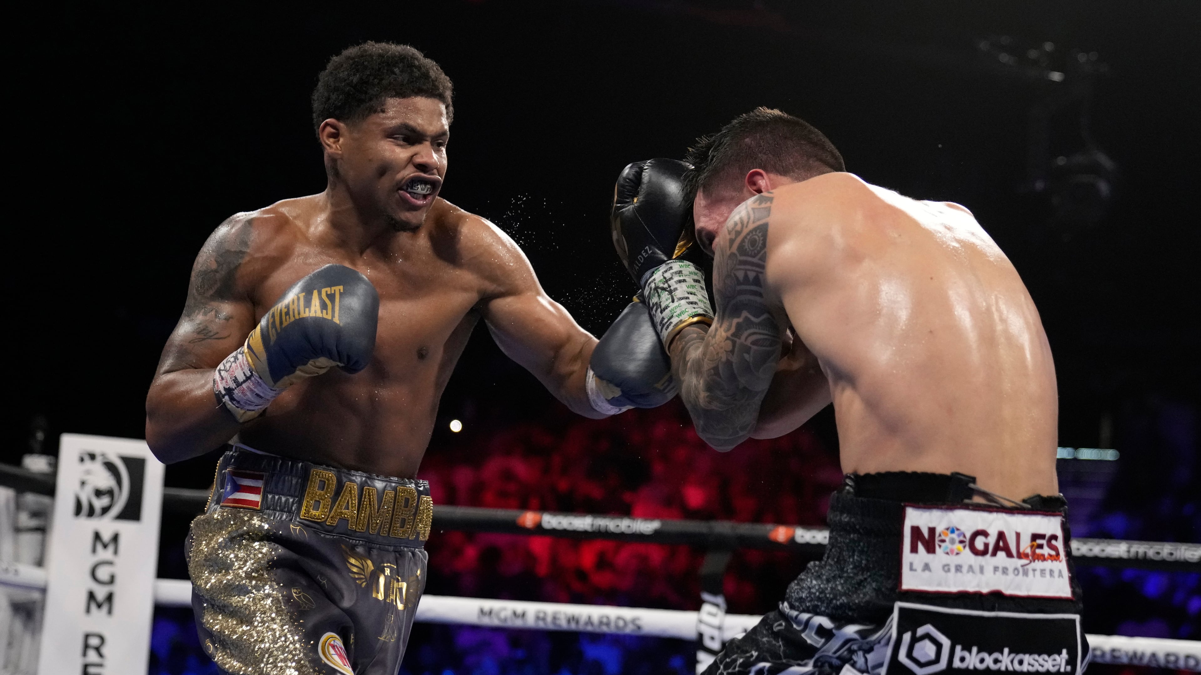 FILE - Shakur Stevenson, left, throws a punch at Oscar Valdez during the WBC-WBO junior lightweight title boxing bout Saturday, April 30, 2022, in Las Vegas. (AP Photo/John Locher, file)