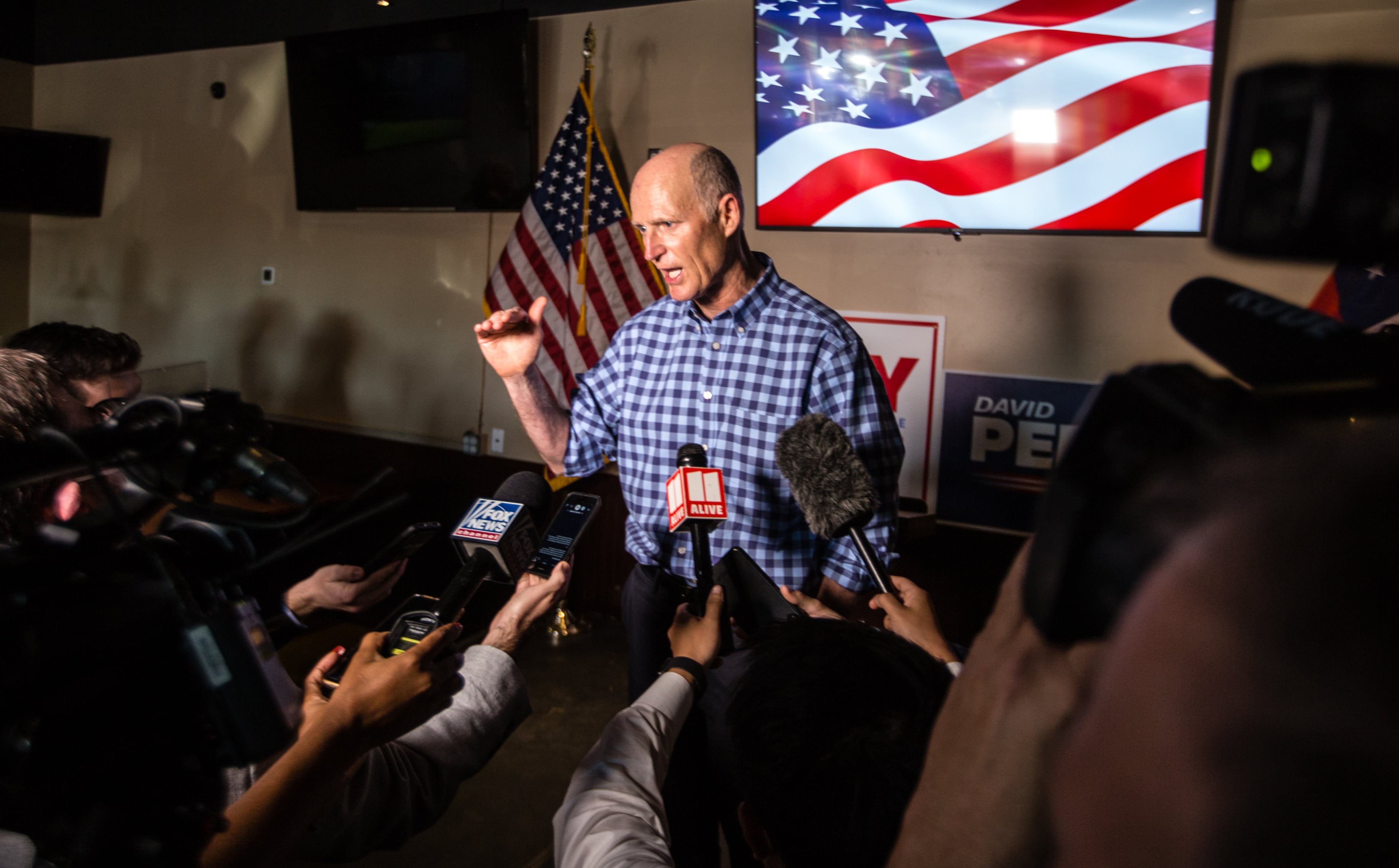 Florida Senator Rick Scott speaks with reporters after the formal rally of support for Senators Kelly Loeffler and David Perdue ends on Friday, November 13, 2020 at Black Diamond Grill in Cumming, GA. (Jenni Girtman for The Atlanta Journal Constitution)