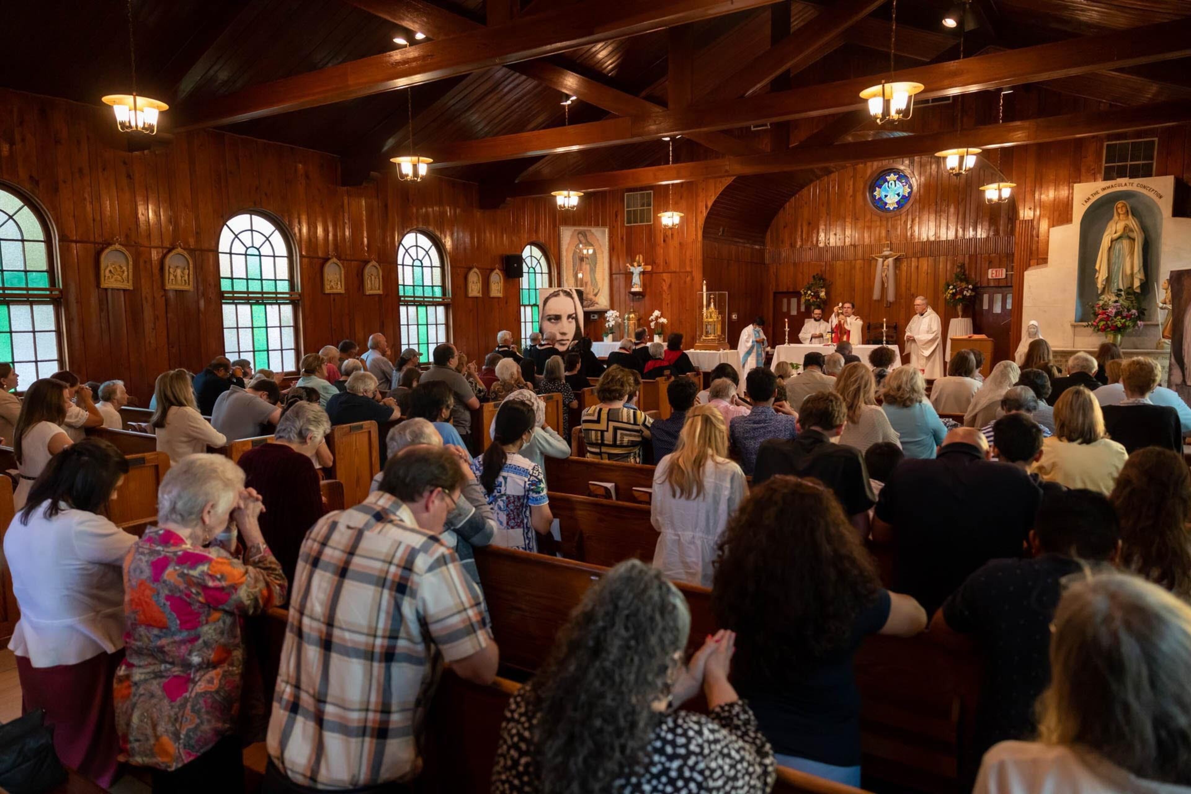 Parishioners pray during a special service honoring the relics of St. Bernadette at Our Lady of Lourdes Catholic Church in Port Wentworth.