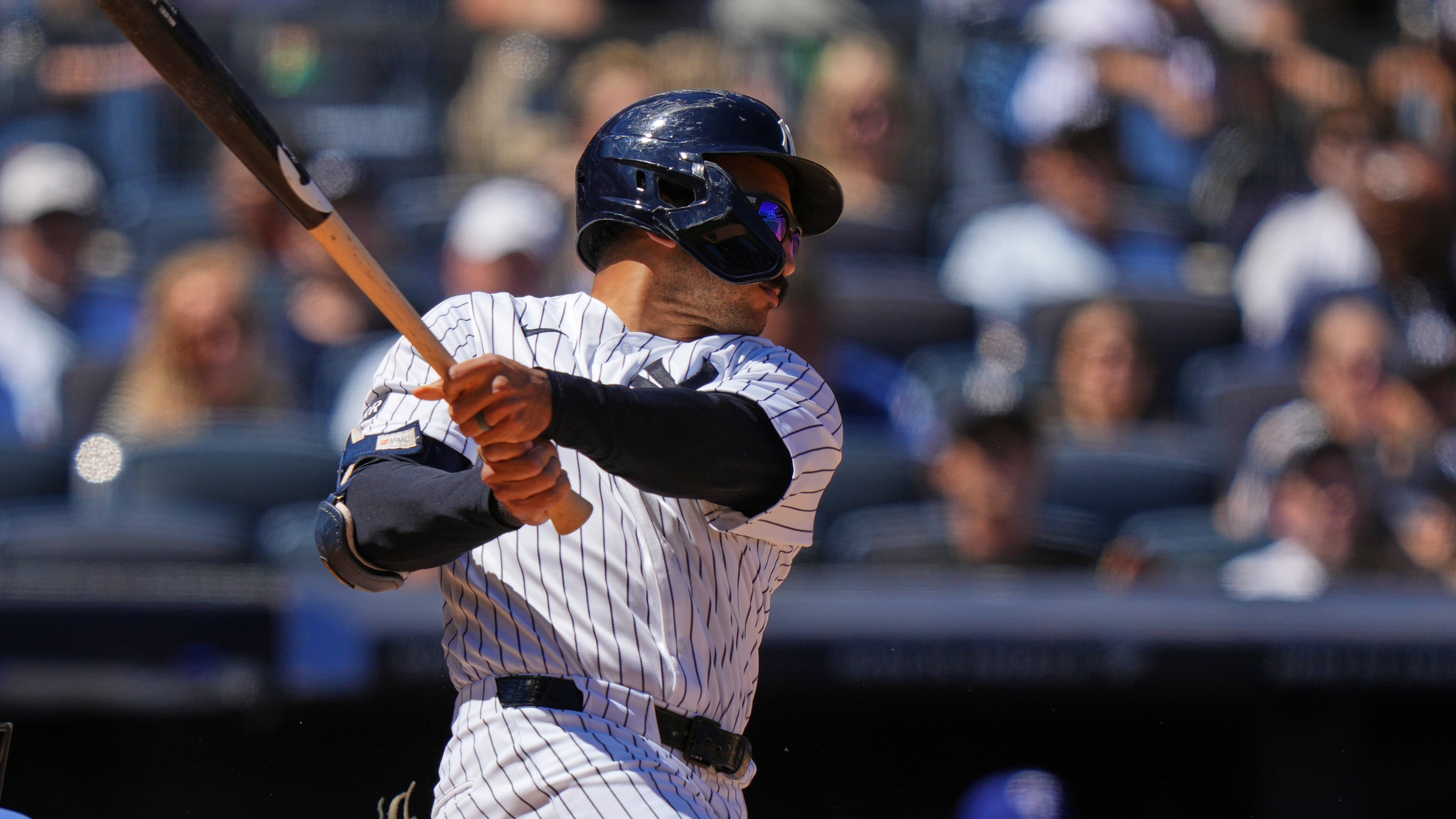 New York Yankees' Trent Grisham follows through on a three-run double during the sixth inning of a baseball game against the Texas Rangers Thursday, May 7, 2026, in New York. (AP Photo/Frank Franklin II)