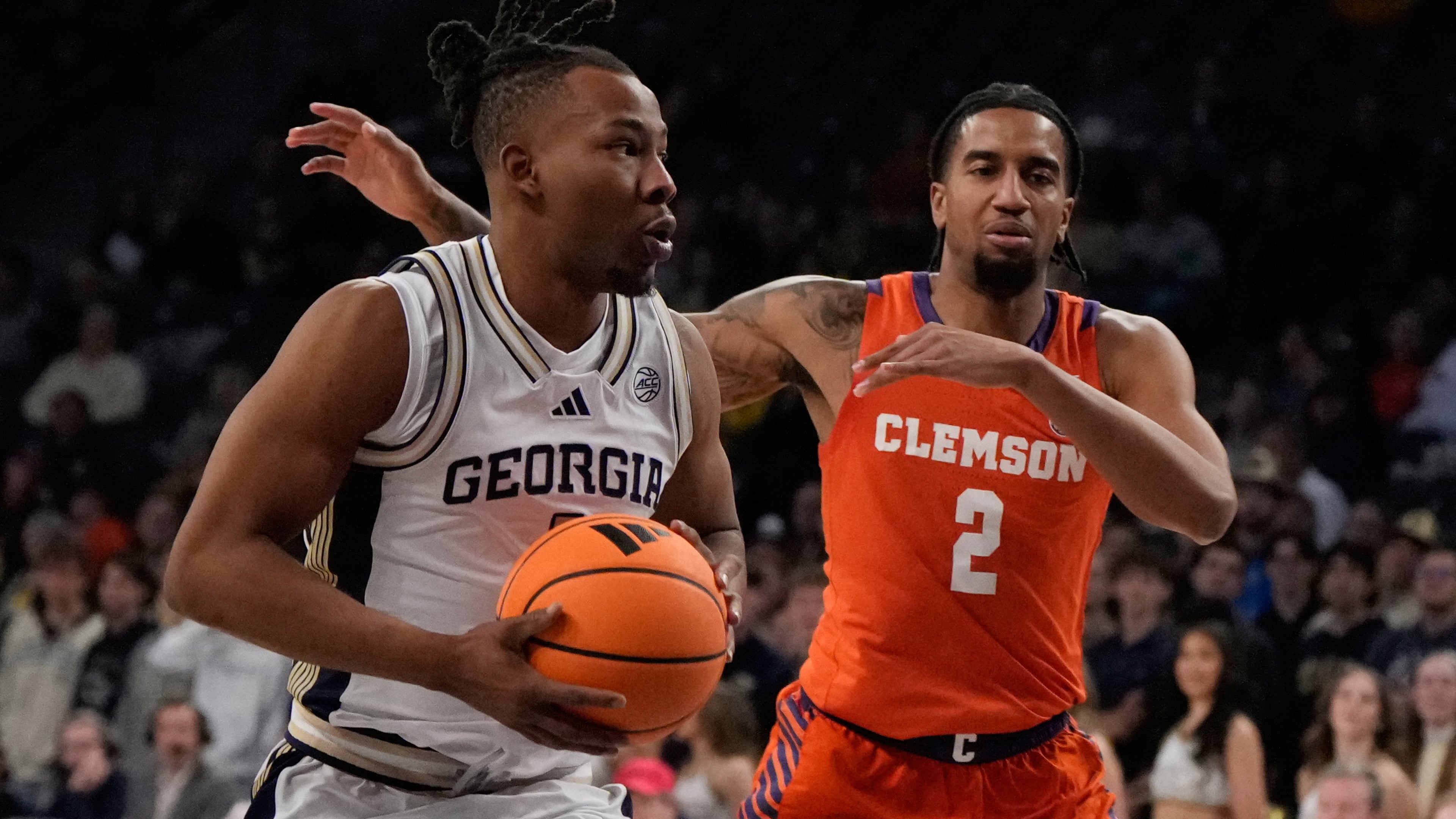 Georgia Tech guard Lamar Washington dribbles the ball against Clemson guard Dillon Hunter during the first half of an NCAA college basketball game against, Saturday, Jan. 24, 2026, in Atlanta. (Brynn Anderson/AP)