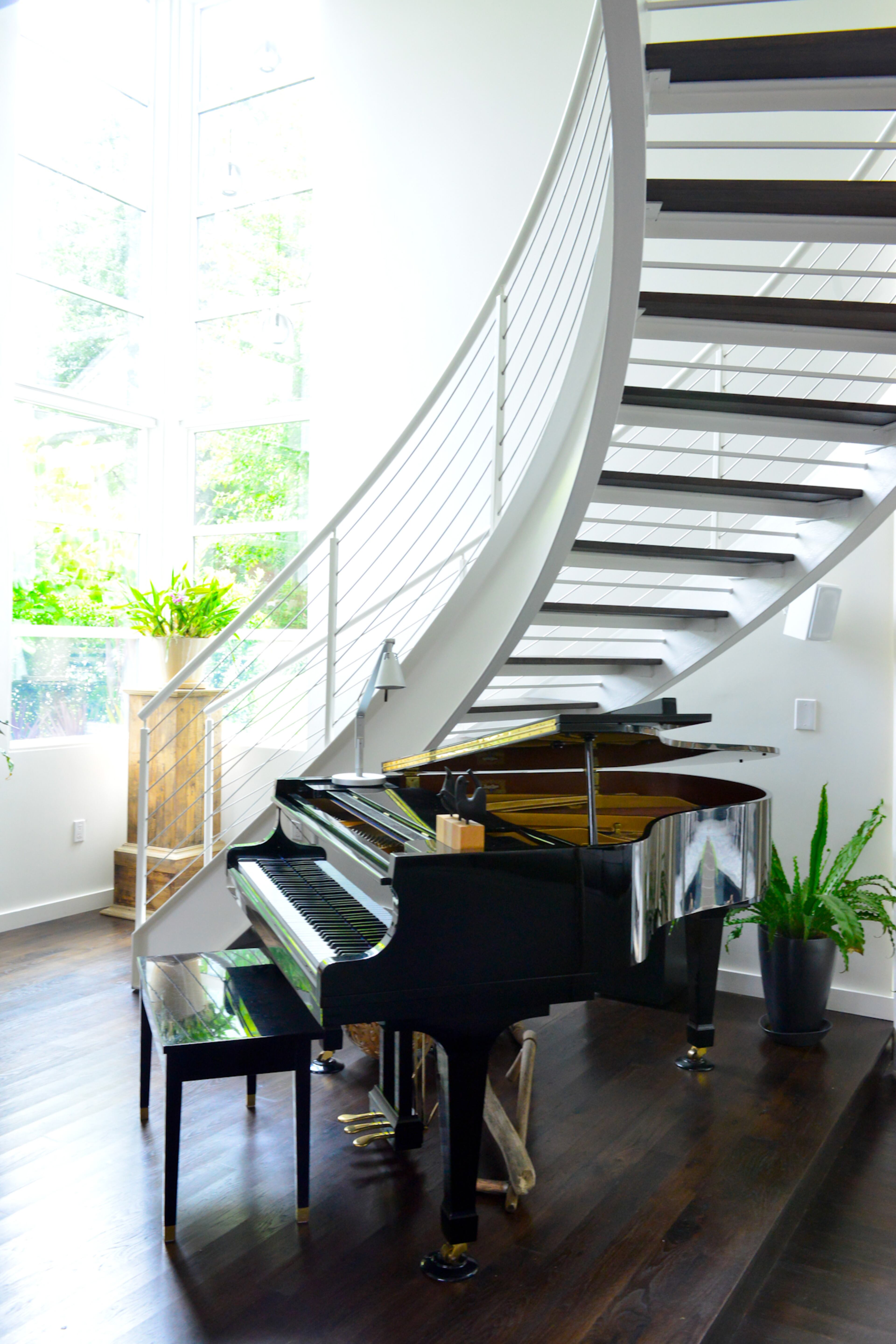 A curved stairwell was on Randy Harris’ and John Carroll’s dream home list from the beginning. Even when it was more budget-friendly to make the stairwell more straight and traditional, the couple didn’t want to lose that feature in their home, which is among 10 properties on Old Fourth Ward Tour of Homes on Sept. 15, 2013. -- Text by Lori Johnston