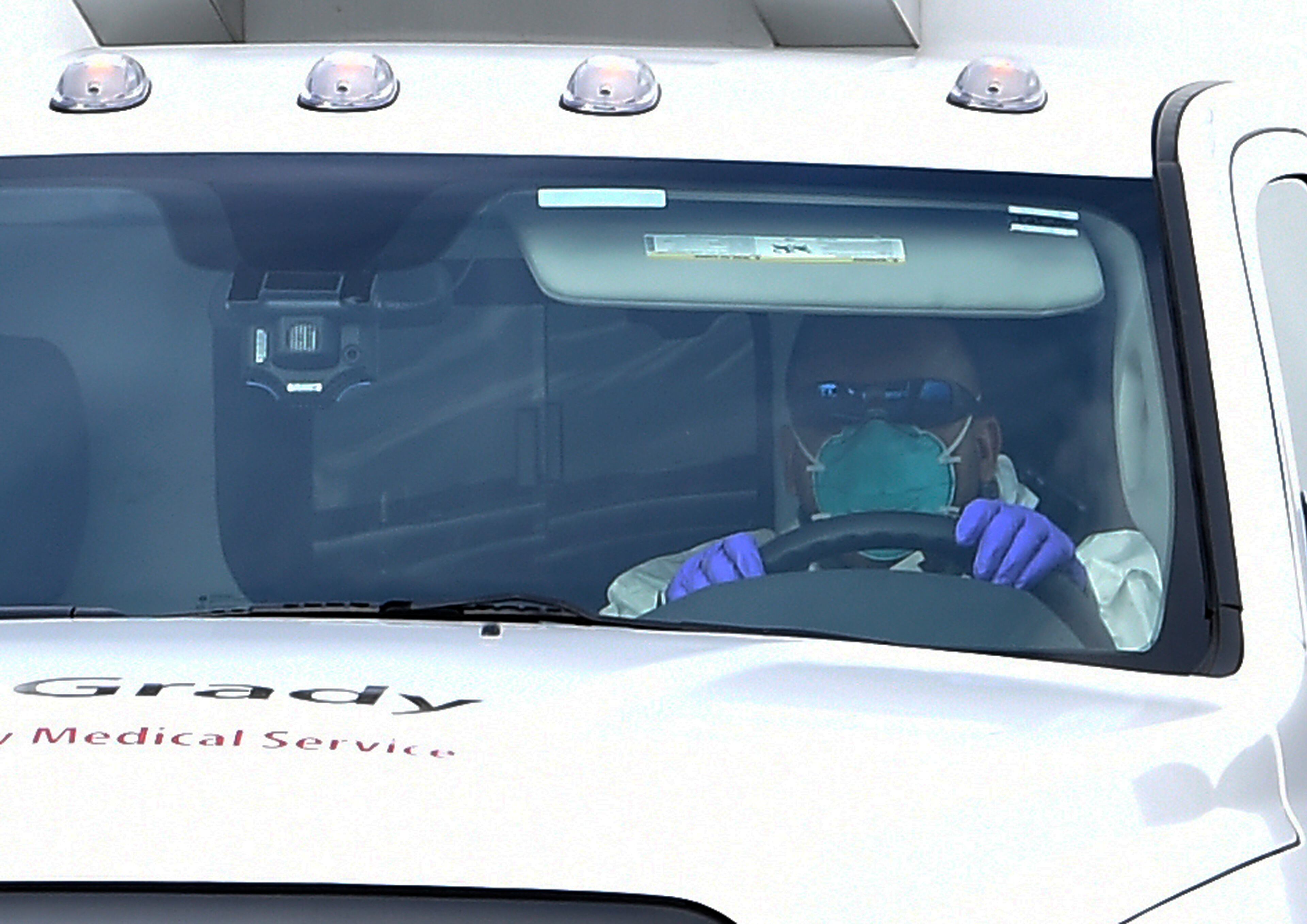 An ambulance transporting an American infected with the deadly Ebola virus from West Africa, leaves Dobbins Air Reserve Base Tuesday, Sept. 9, 2014 in Marietta, Ga., for Emory University Hospital in Atlanta. A joint emergency isolation unit administered by Emory University Hospital and the Centers for Disease Control and Prevention successfully treated two Americans last month in Atlanta. (AP Photo/David Tulis)