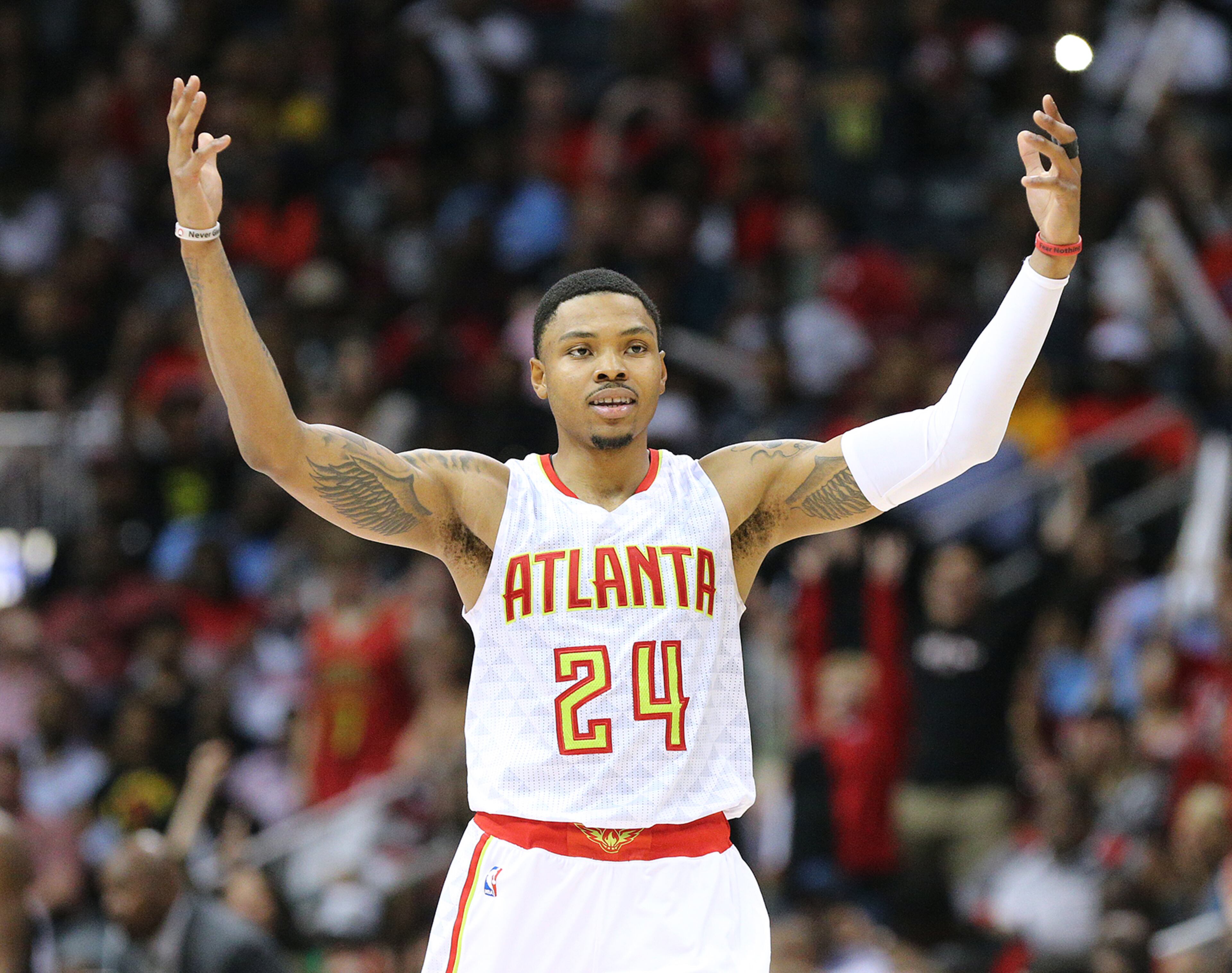Kent Bazemore looks to the fans to cheer after hitting a three pointer against the Washington Wizards during a 111-101 victory in game 4 of a first-round NBA basketball playoff series on Monday, April 24, 2017, in Atlanta.