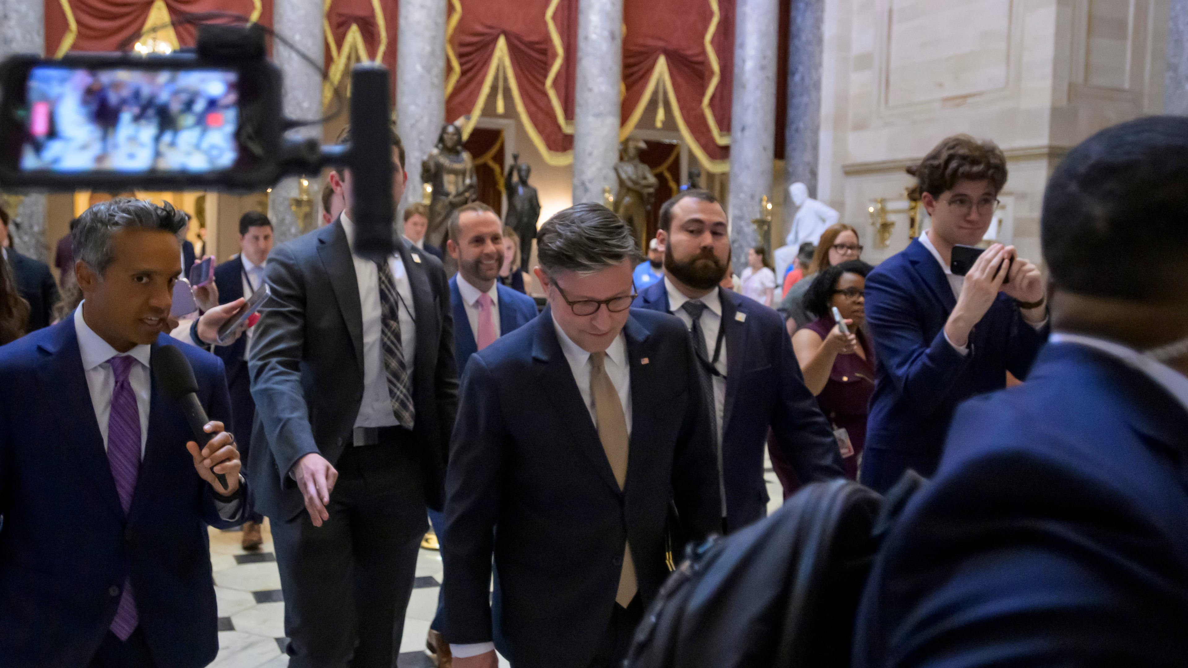 Speaker of the House Mike Johnson, R-La., talks with reporters as he walks to his office following a vote at the Capitol, Tuesday, June 30, 2026, in Washington. (AP Photo/Rod Lamkey, Jr.)