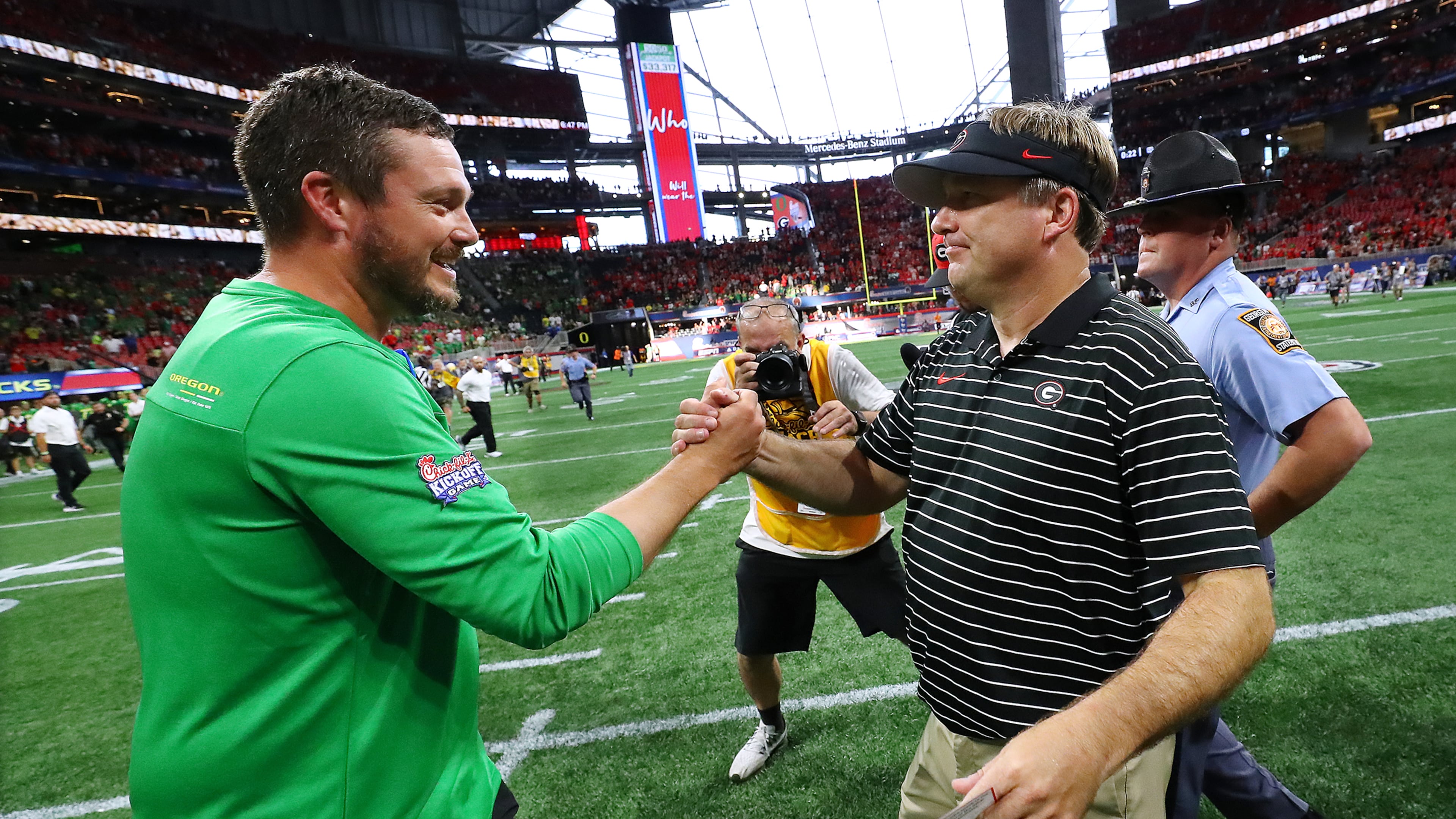 Georgia's Kirby Smart and Oregon Dan Lanning's meet at the end of the game after the Bulldogs won 49-3 on Saturday, Sept. 3, 2022, in Atlanta. (Curtis Compton/AJC)