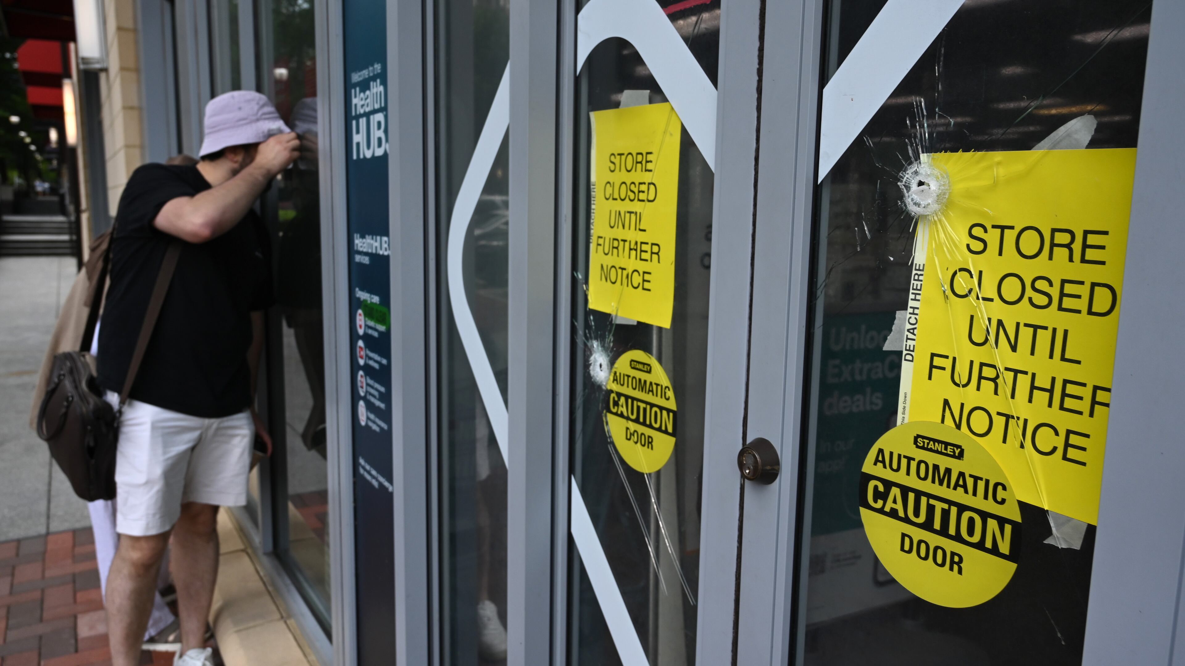 Bullet holes are visible at the Emory Point CVS on Saturday, Aug. 9, 2025, after a deadly shooting Friday. A man opened fire on the Centers for Disease Control and Prevention on Friday, killing a police officer who tried to stop him, authorities said. (Hyosub Shin/AJC)