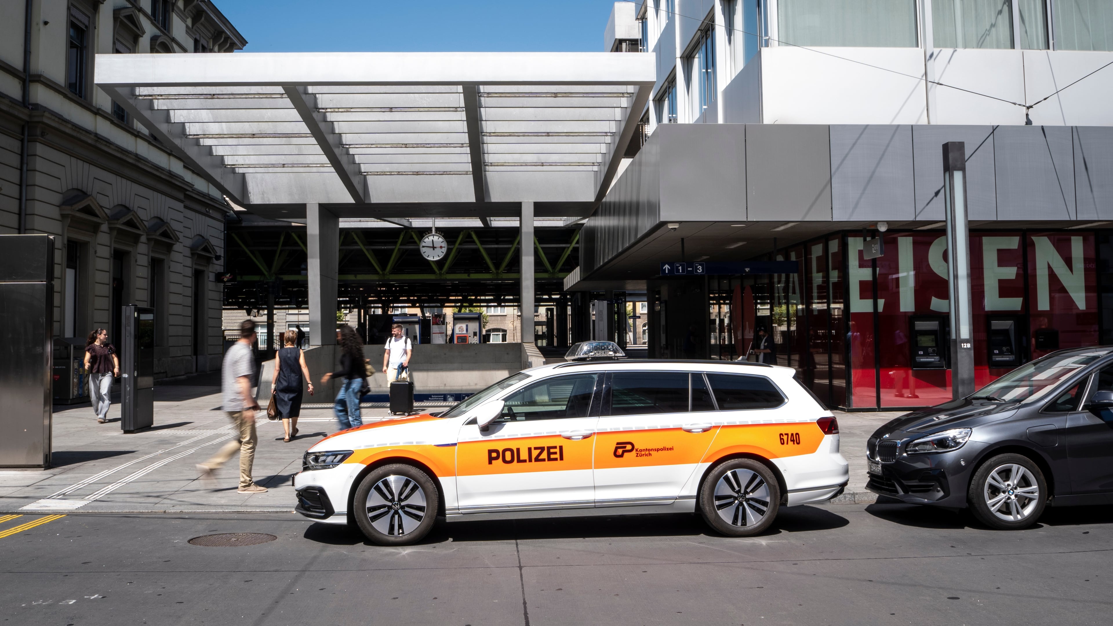 A police vehicle is parked in front of Winterthur train station following a stabbing attack in Winterthur, Switzerland, Thursday, May 28, 2026. (Claudio Thoma/Keystone via AP)