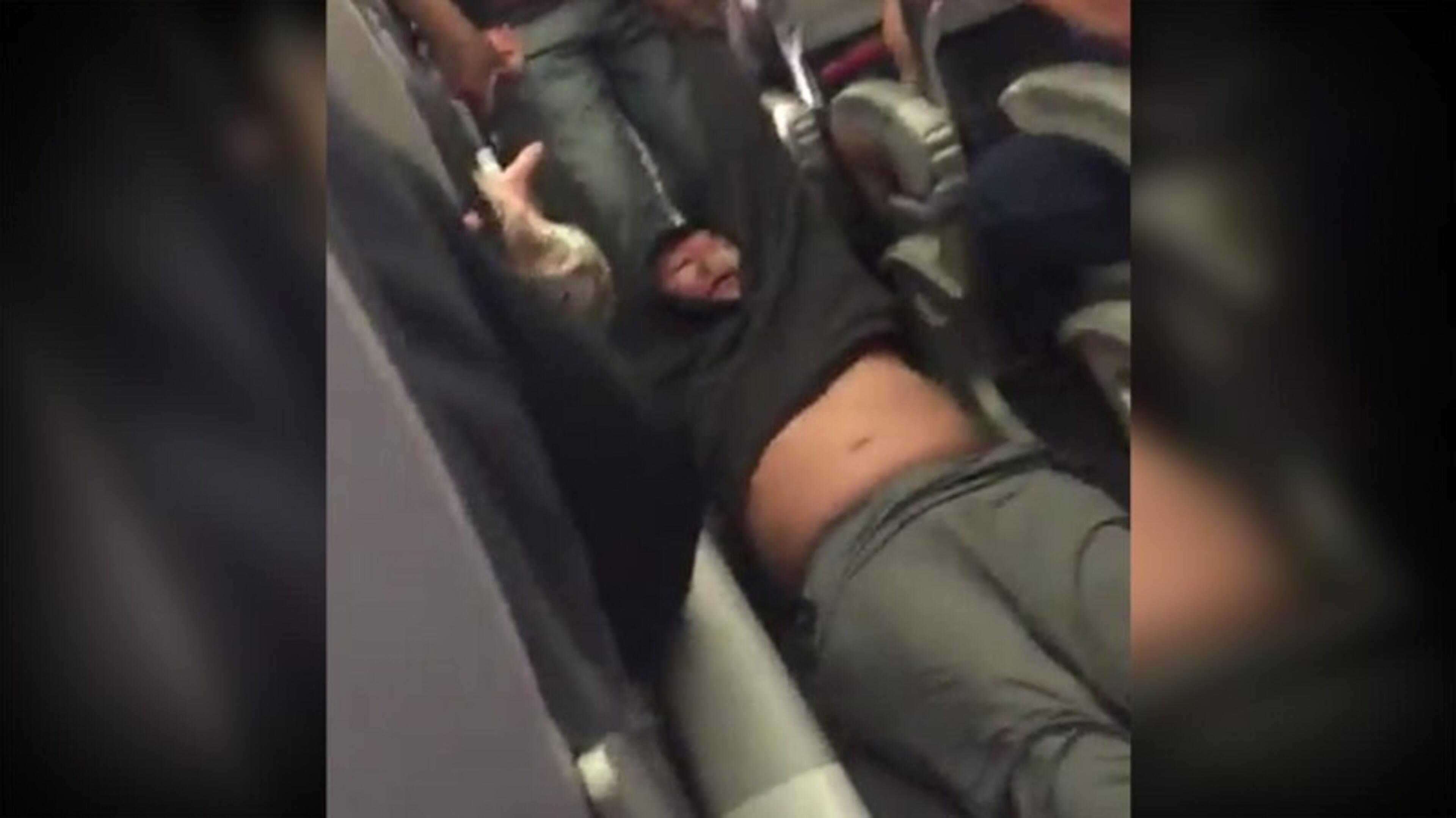 This Sunday, April 9, 2017, image made from a video provided by Audra D. Bridges shows a passenger being removed from a United Airlines flight in Chicago.