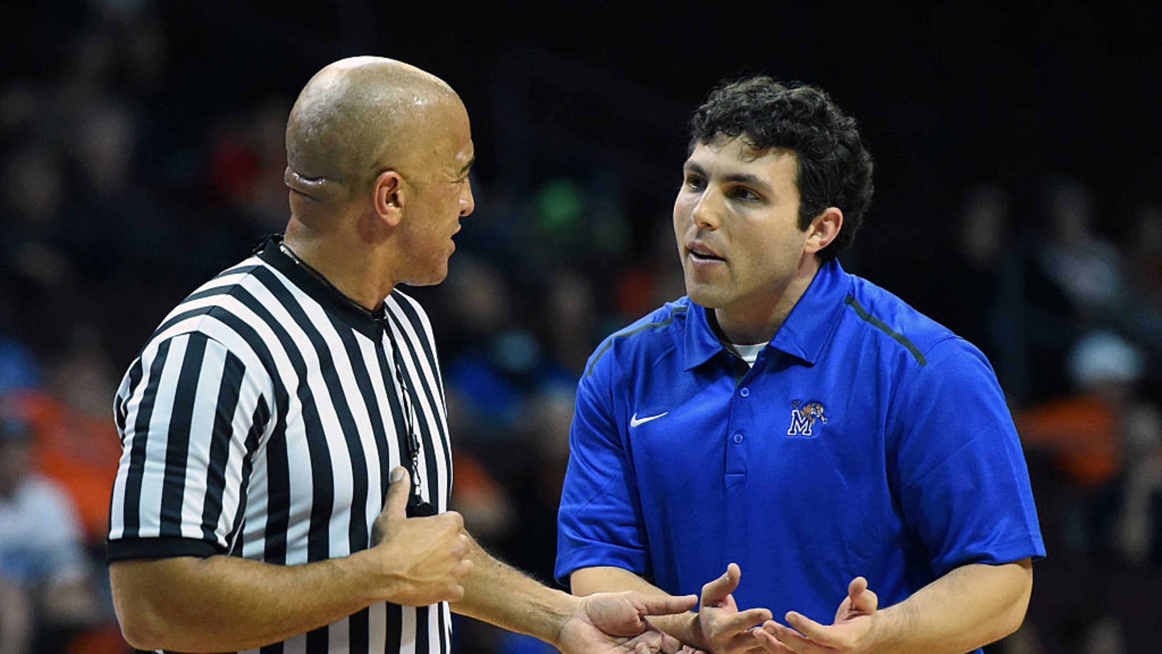 LAS VEGAS, NV - NOVEMBER 28: Head coach Josh Pastner of the Memphis Tigers talks with a referee during a timeout in the team's game against the Indiana State Sycamores during the 2014 Continental Tire Las Vegas Invitational basketball tournament at the Orleans Arena on November 28, 2014 in Las Vegas, Nevada. Memphis won 72-62. (Photo by Ethan Miller/Getty Images)