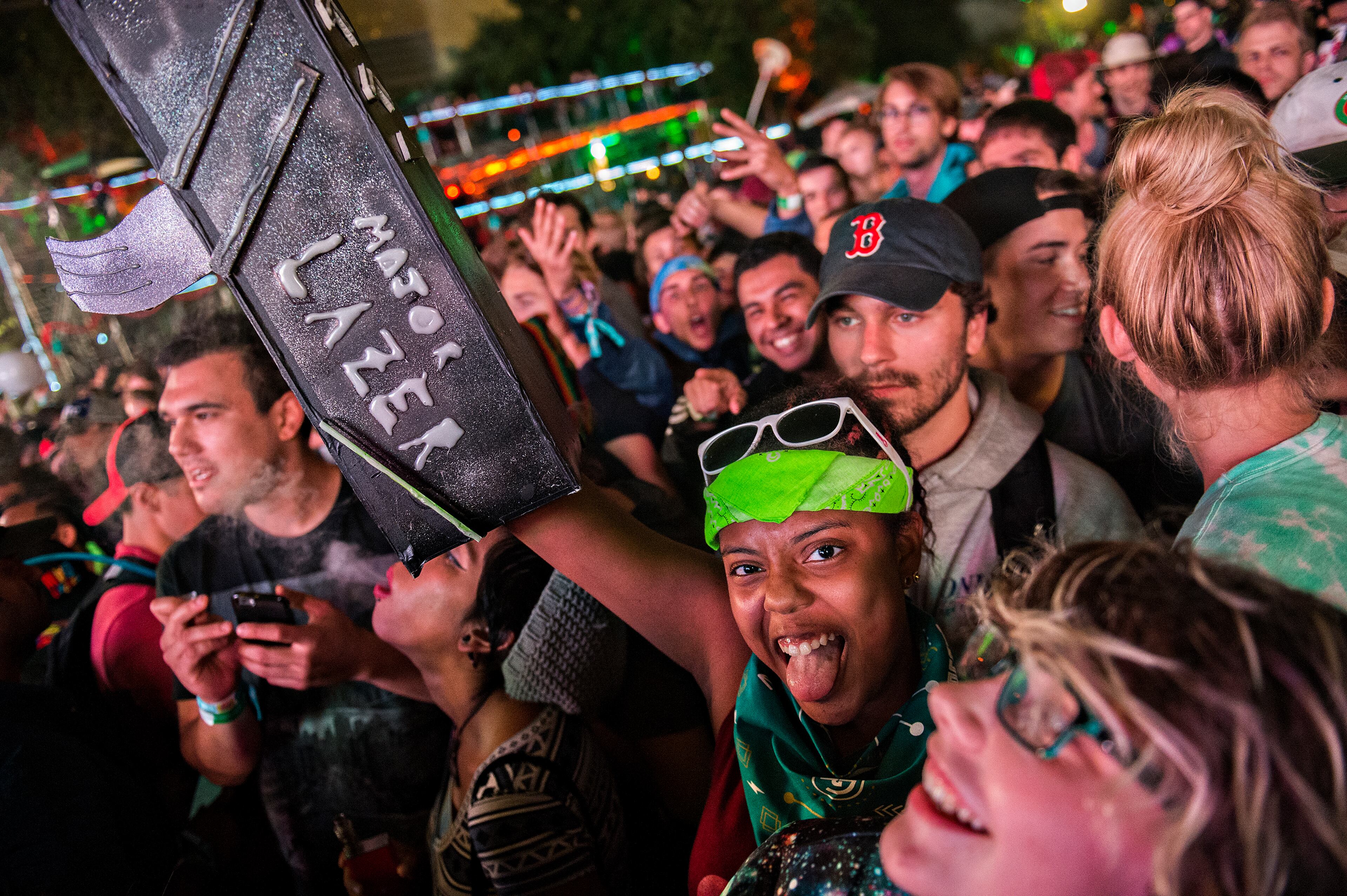 Sydnee Wade (center) lifts her lazer gun in the air as she waits for Major Lazer to perform during the first night of the Shaky Beats Music Festival at Centennial Olympic Park in Atlanta on Friday, May 20, 2016. JONATHAN PHILLIPS / SPECIAL