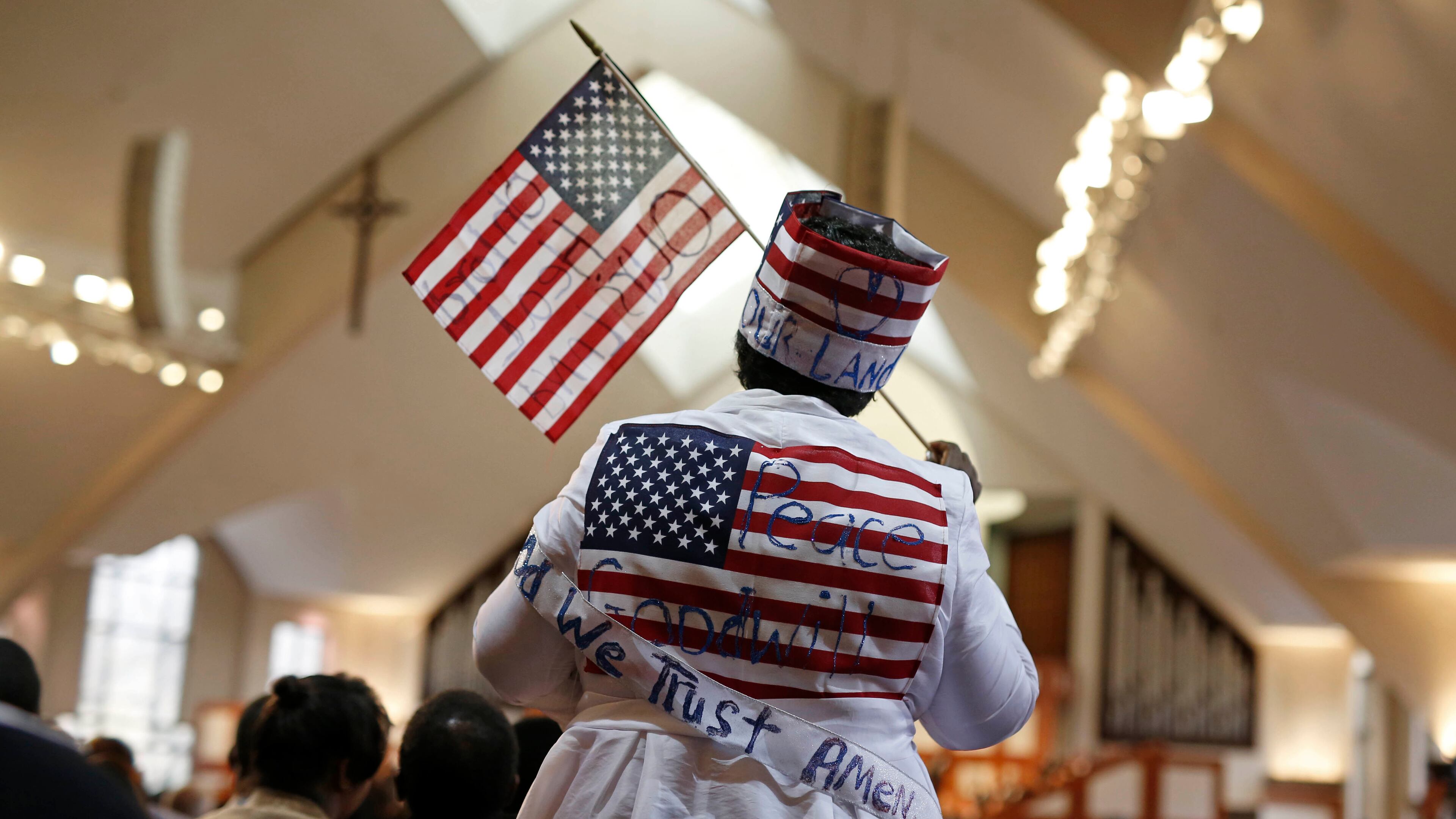 January 16, 2017 - Atlanta, Ga: Ann Breedlove wears a patriotic outfit as she reacts to comments during the 49th annual Martin Luther King Jr. Commemorative Service at Ebenezer Baptist Church Monday, January 16, 2017, in Atlanta, Ga. PHOTO / JASON GETZ