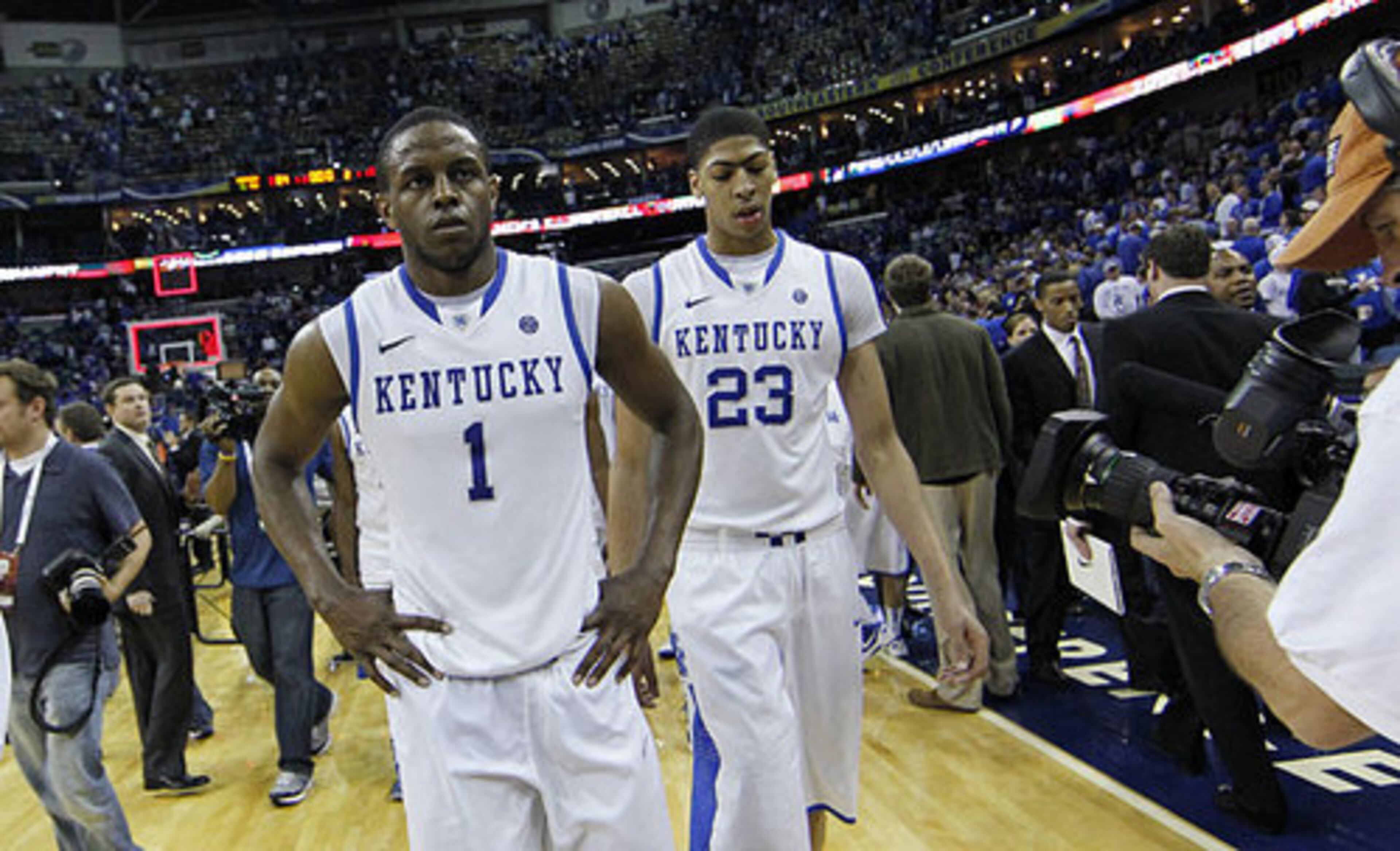 Kentucky guard Darius Miller (1) and Kentucky forward Anthony Davis (23) walks off the court following a 71-64 loss to Vanderbilt during the second half of an NCAA college basketball game in the championship game of the 2012 Southeastern Conference tournament at the New Orleans Arena in New Orleans, Sunday, March 11, 2012.