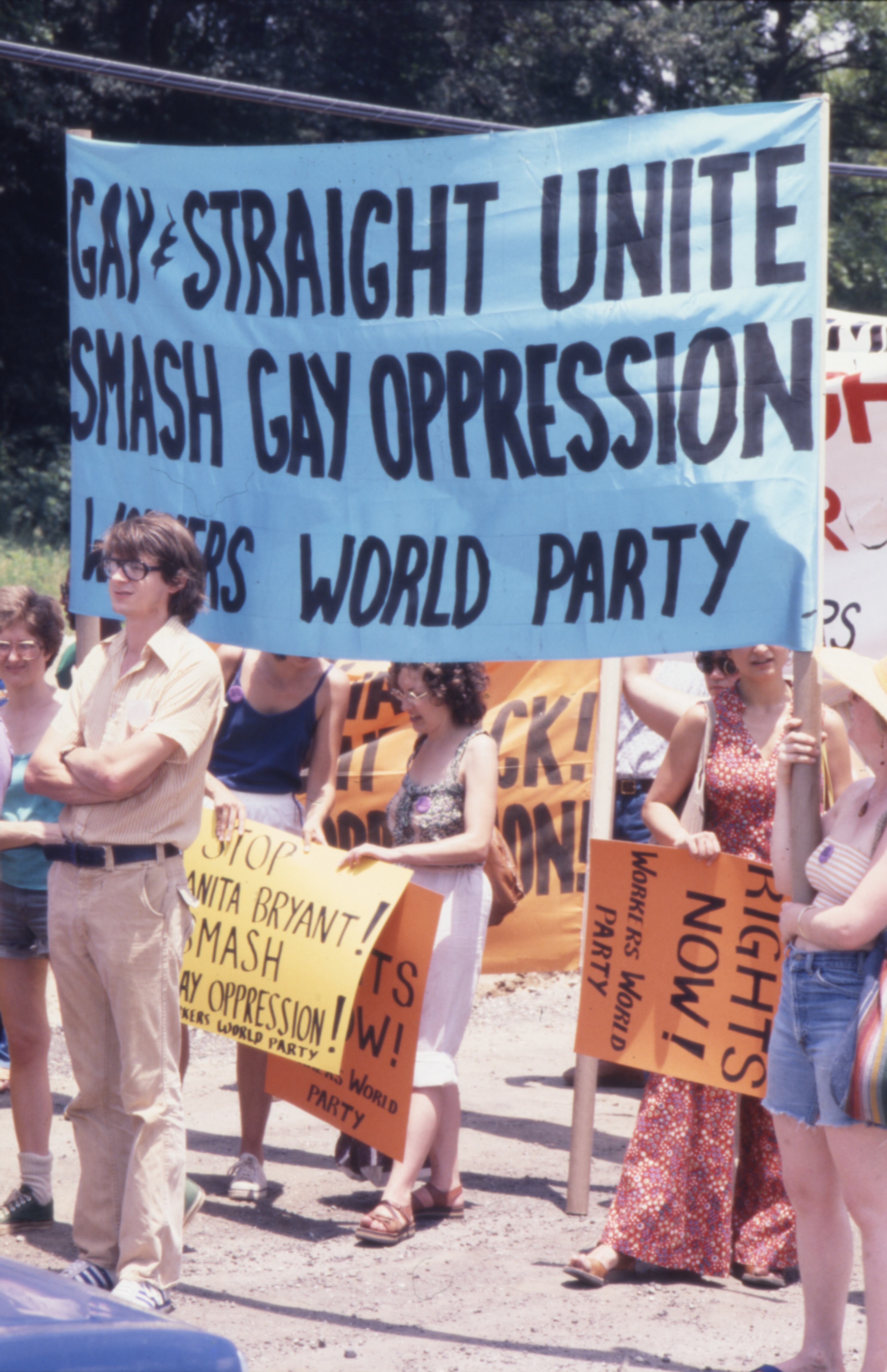 Workers World Party group marching in the Atlanta Pride parade with a sign reading "Gay and straight unite. Smash gay oppression," 1977. (Atlanta Journal-Constitution Photographic Archives. Special Collections and Archives, Georgia State University Library.)