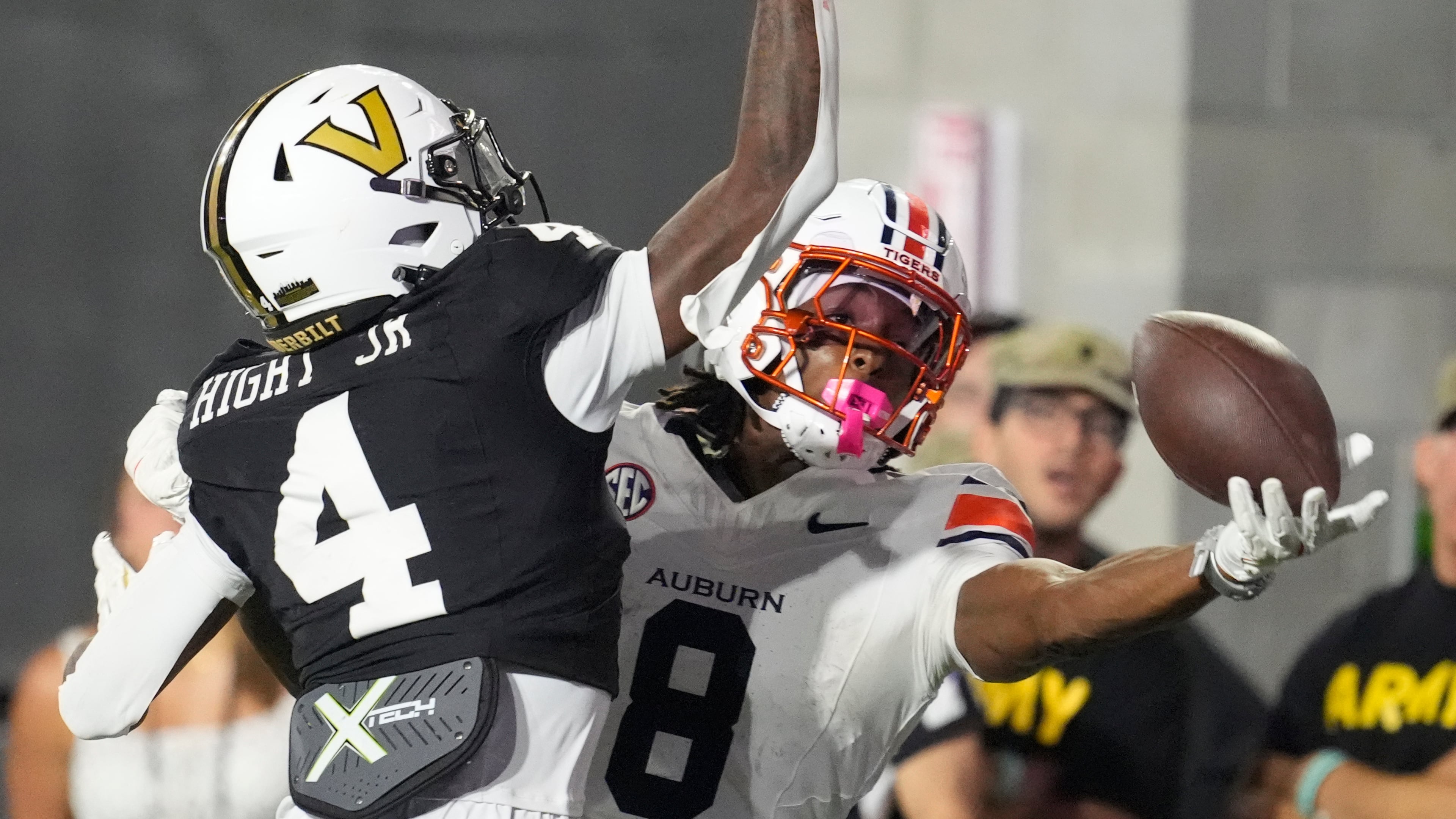 FILE - Auburn wide receiver Cam Coleman (8) catches a touchdown pass in the end zone past Vanderbilt cornerback Martel Hight (4) during the second half of an NCAA college football game, Nov. 8, 2025, in Nashville, Tenn. (AP Photo/George Walker IV, File)