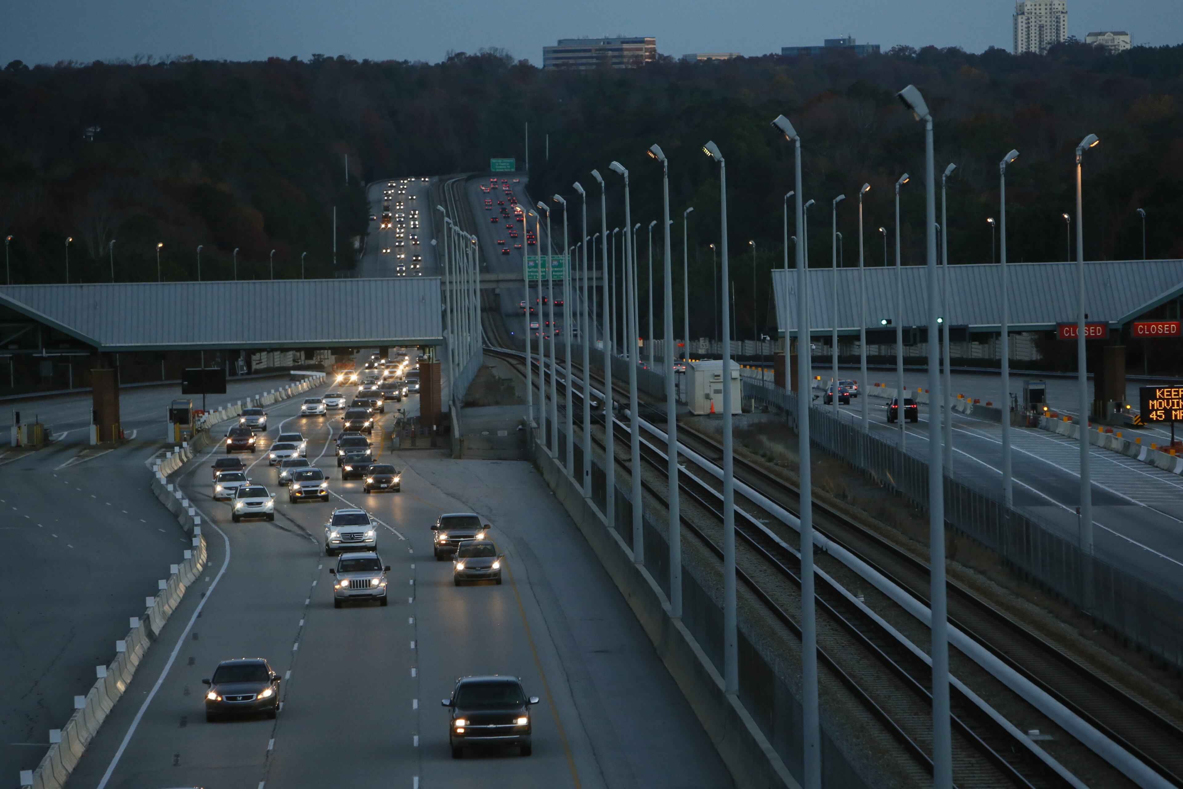 After tolls were eliminated on Georgia 400, traffic has increased and speeds at rush hour are slower, according to traffic counts. This photo was taken on the first morning after tolls were eliminated in November 2013. BOB ANDRES/BANDRES@AJC.COM