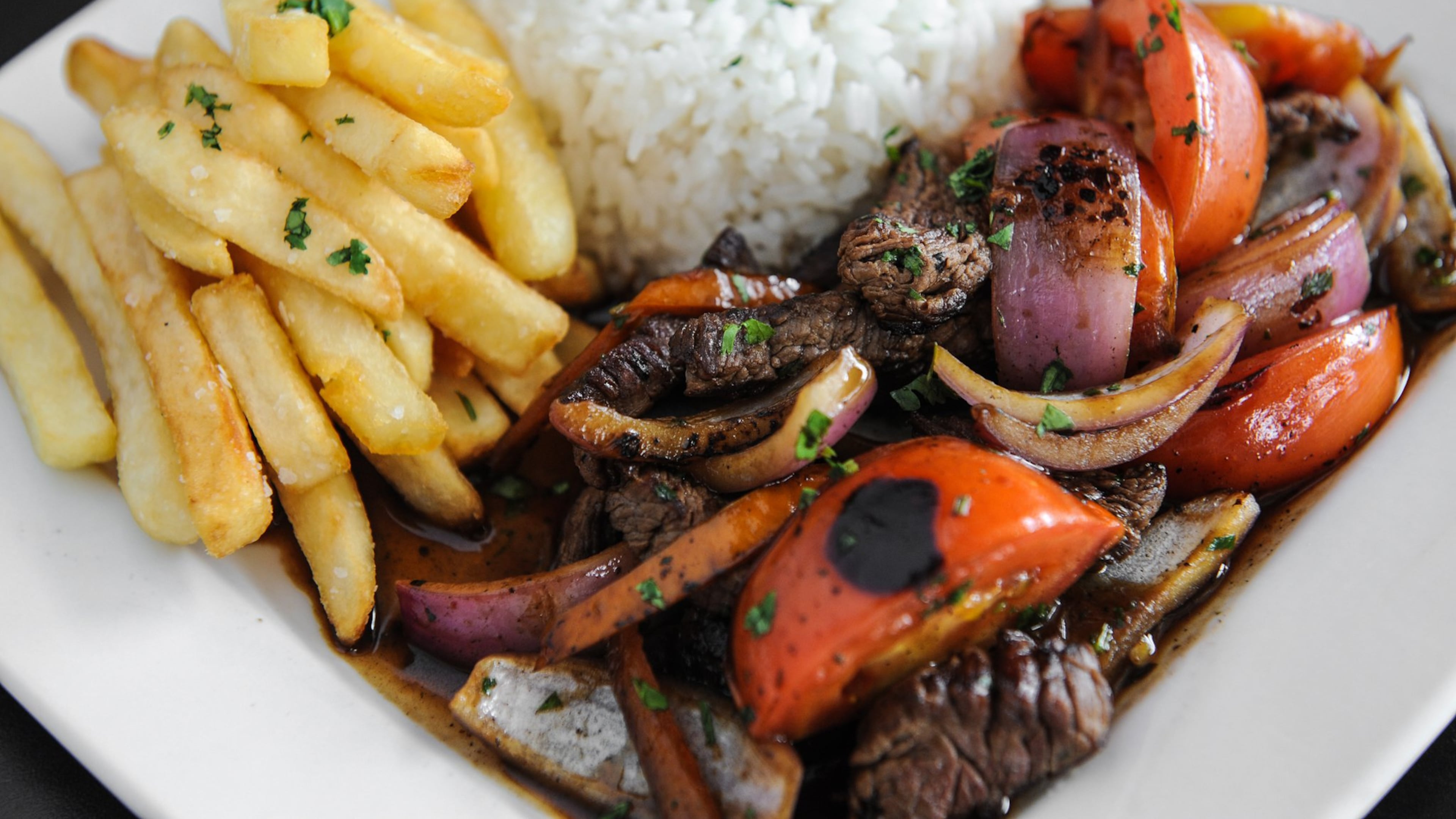 The Freakin Incan’s Lomo Saltado, stir-fried beef, served with white rice and fries. (Beckysteinphotography.com)