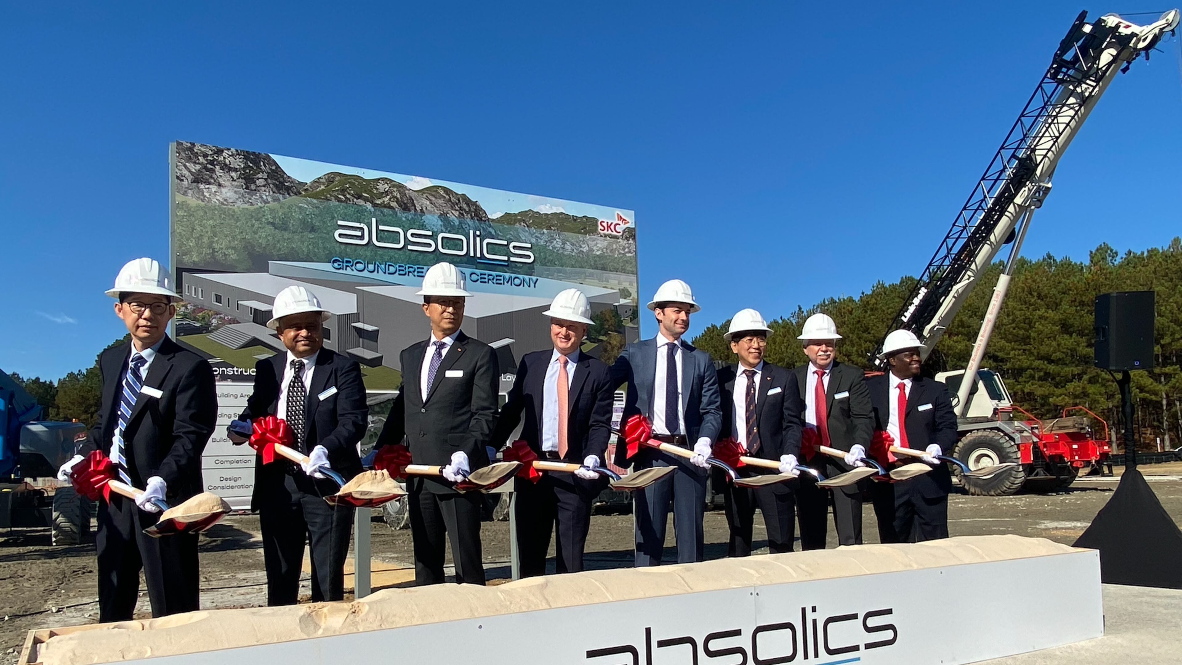 Absolics, which is building a factory in Covington that will craft vital components for making semiconductors, will receive grant funding from a federal program designed to boost domestic computer chip manufacturing. U.S. Sen. Jon Ossoff, (fourth from right), D-Ga., said incentives were fueled by the bipartisan CHIPS and Science Act,
