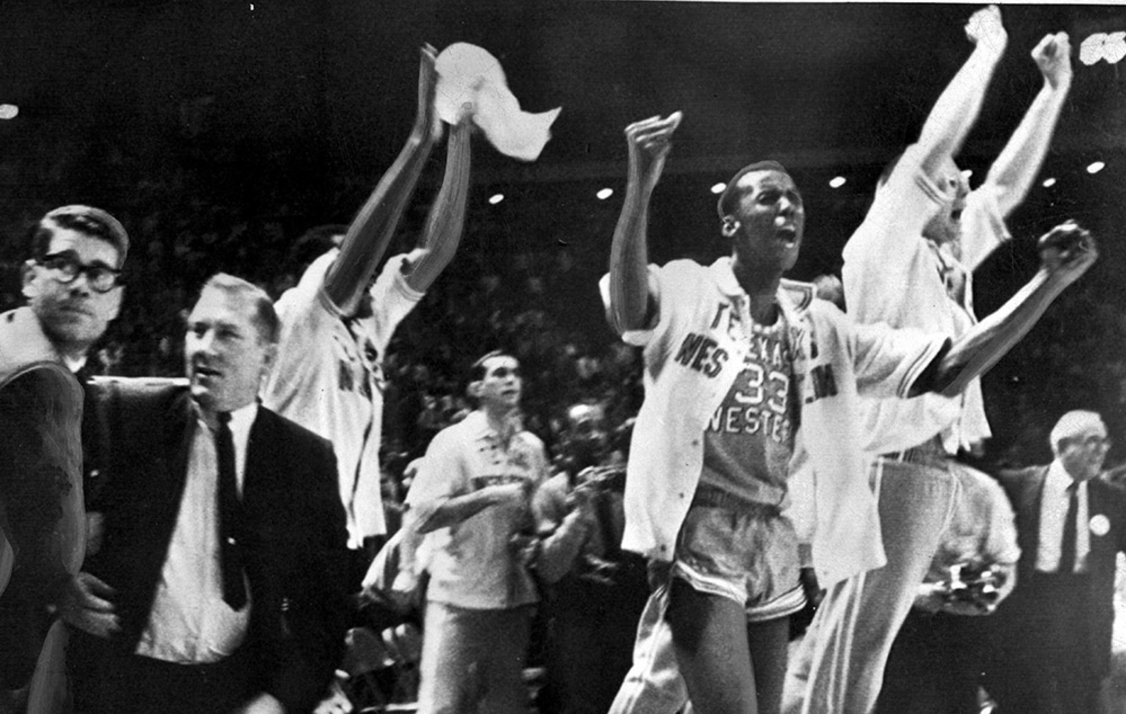 Texas Western basketball coach Don Haskins (second from left) and players celebrate winning the 1966 NCAA basketball championship in College Park, Md.