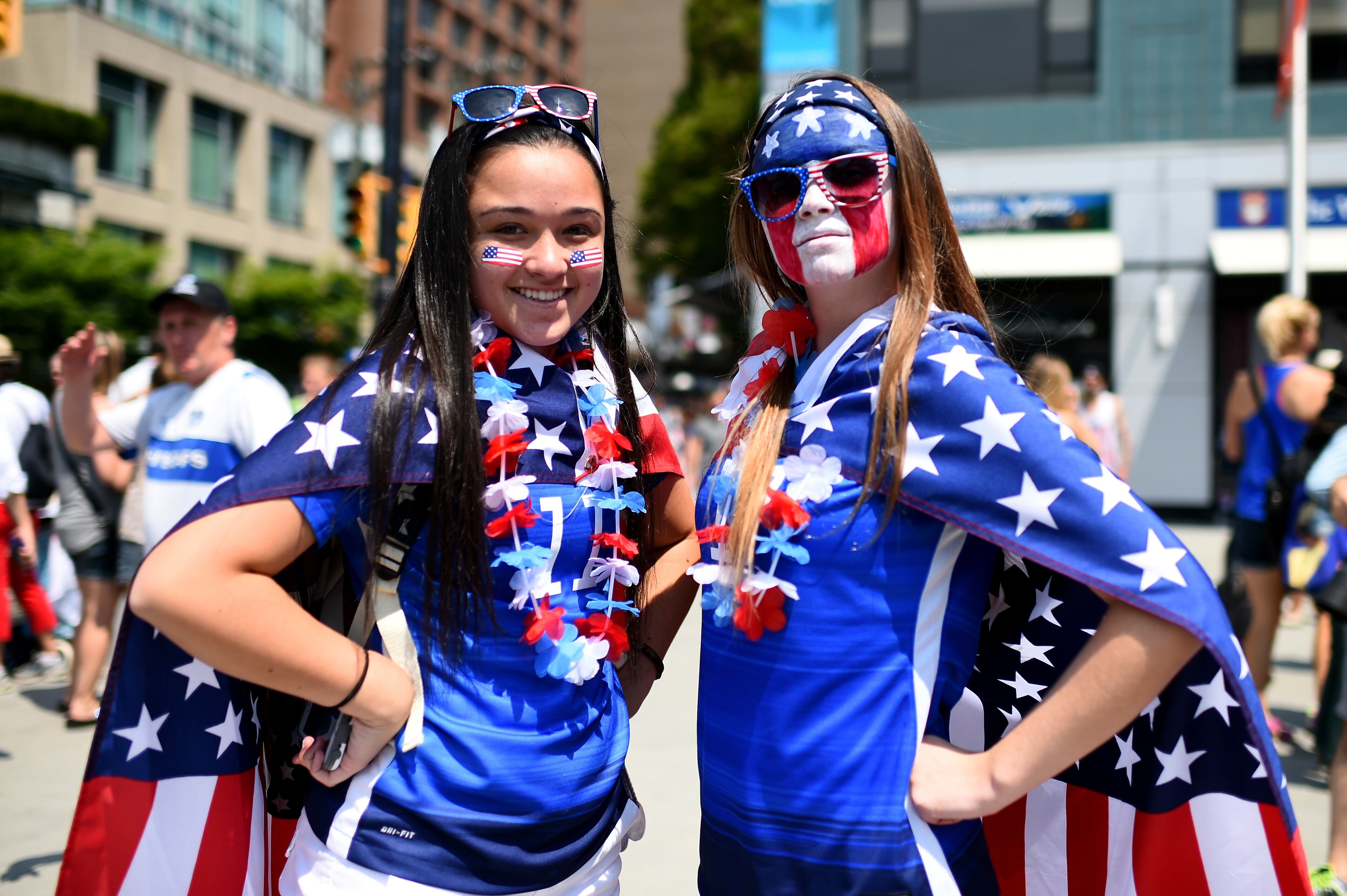 VANCOUVER, BC - JULY 05: Fans of the United States pose outside BC Place Stadium before the USA takes on Japan in the FIFA Women's World Cup Canada 2015 Final on July 5, 2015 in Vancouver, Canada. (Photo by Dennis Grombkowski/Getty Images)