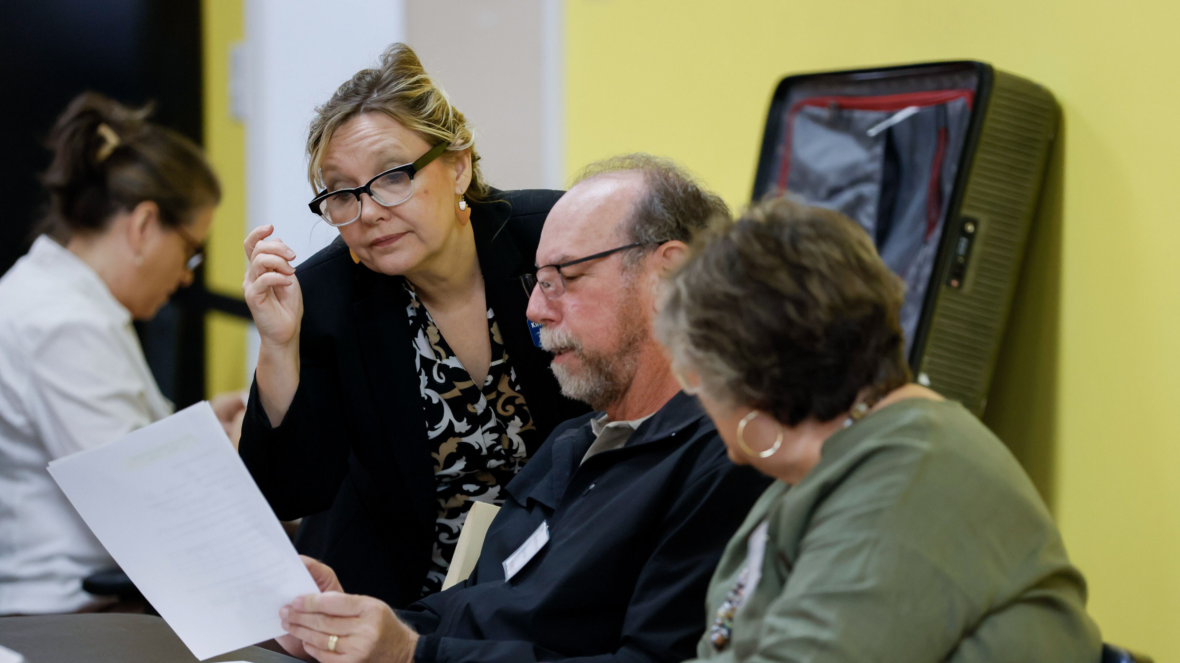 Spalding County Elections Supervisor Kim Slaughter helps poll workers during a hand count of ballots Thursday. The county’s majority-Republican election board voted 3-1 in August to require the hand count of this year’s elections and withhold certification of elections until any discrepancies are resolved. Miguel Martinez /miguel.martinezjimenez@ajc.com