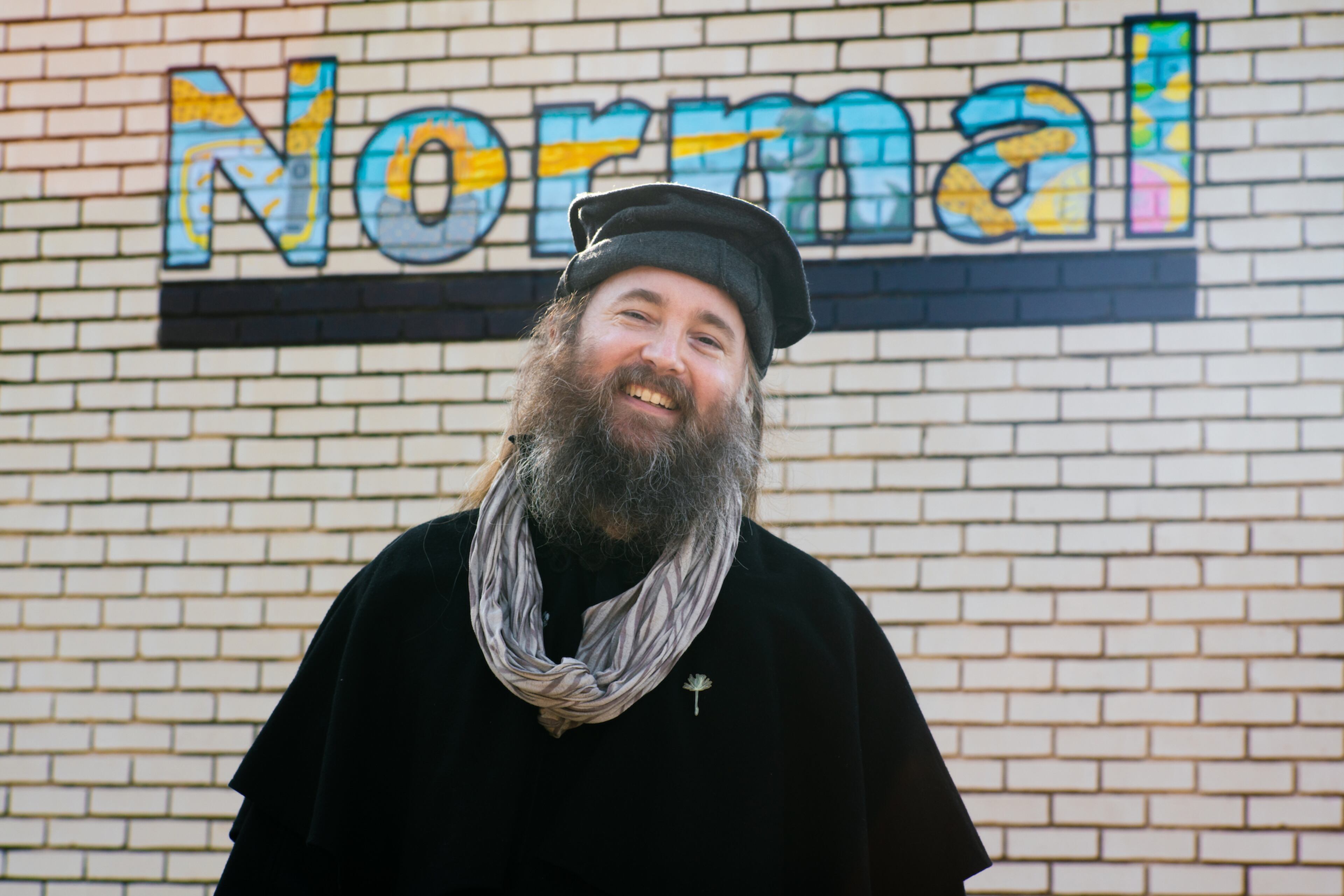 Athens-based artist Noah James Saunders standing outside his favorite bar, Normal, in his Athens neighborhood of Normaltown. (Courtesy of Rouse Photography)