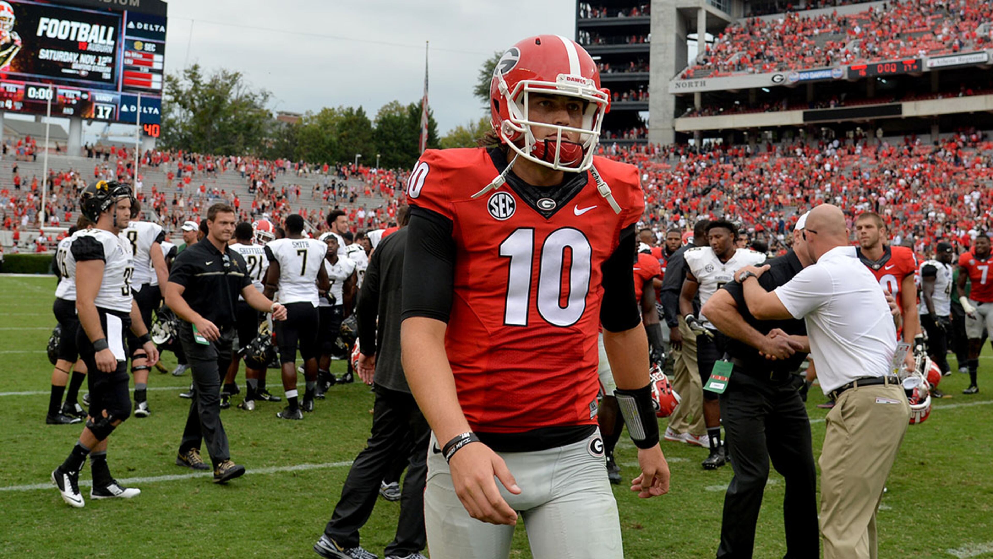 October 15, 2016 Athens, GA: Georgia Bulldogs quarterback Jacob Eason walks off the field after falling 17-16 to the Vanderbilt Commodores at Sanford Stadium Saturday October 15, 2016. BRANT SANDERLIN/BSANDERLIN@AJC.COM