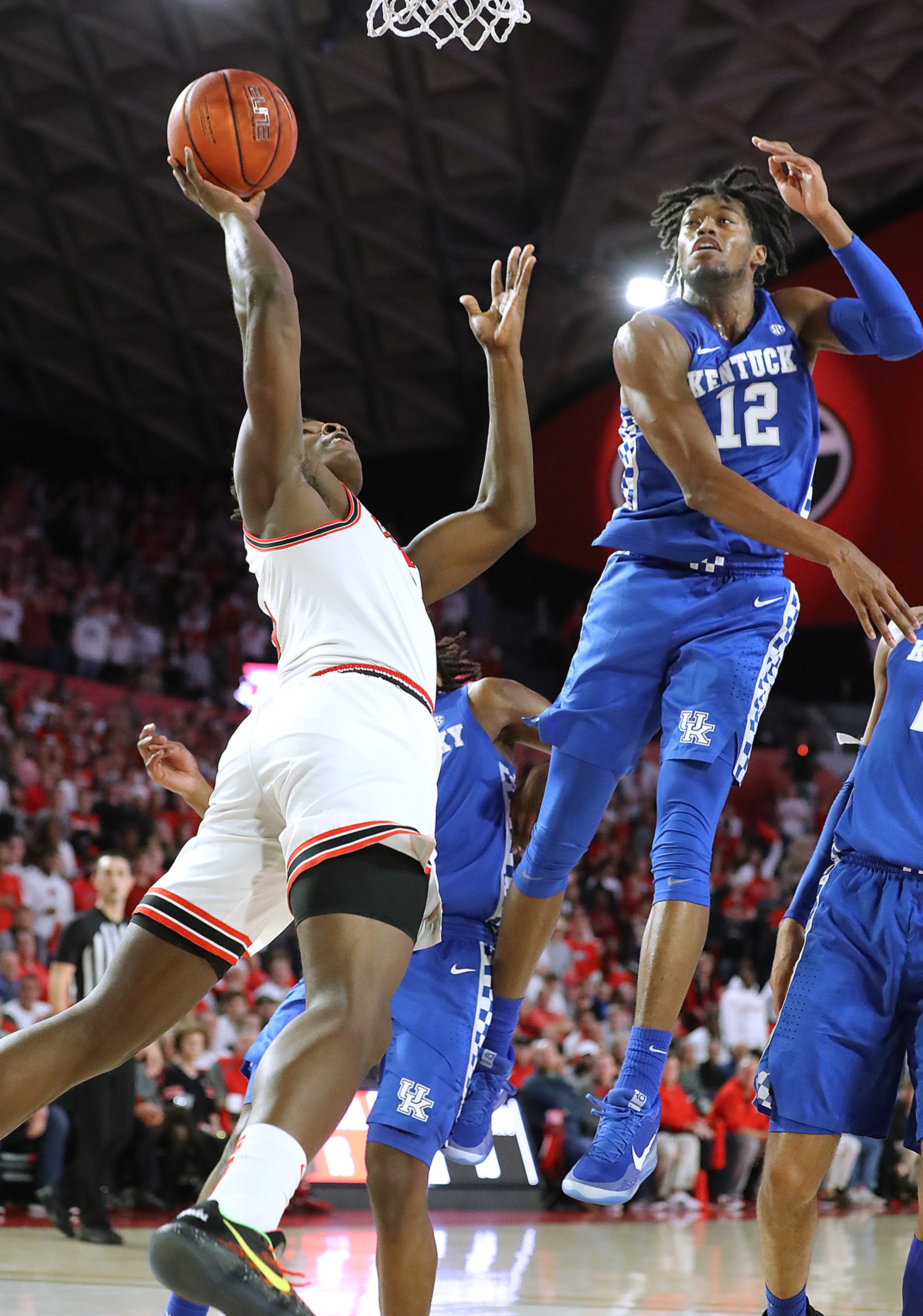 Georgia freshman Anthony Edwards is fouled Kentucky forward Keion Brooks Jr. in a NCAA college basketball game on Tuesday, January 7, 2020, in Athens. Curtis Compton ccompton@ajc.com