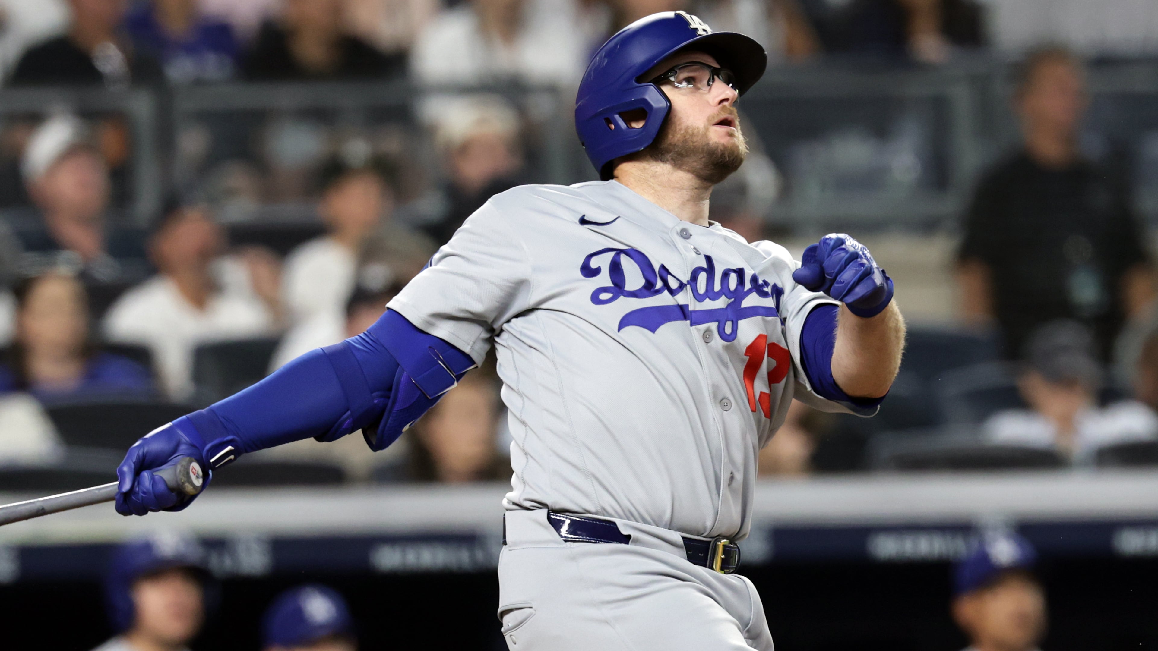 Los Angeles Dodgers' Max Muncy watches his two-run home run during the seventh inning of a baseball game against the New York Yankees, Friday, July 17, 2026, in New York. (AP Photo/Adam Hunger)