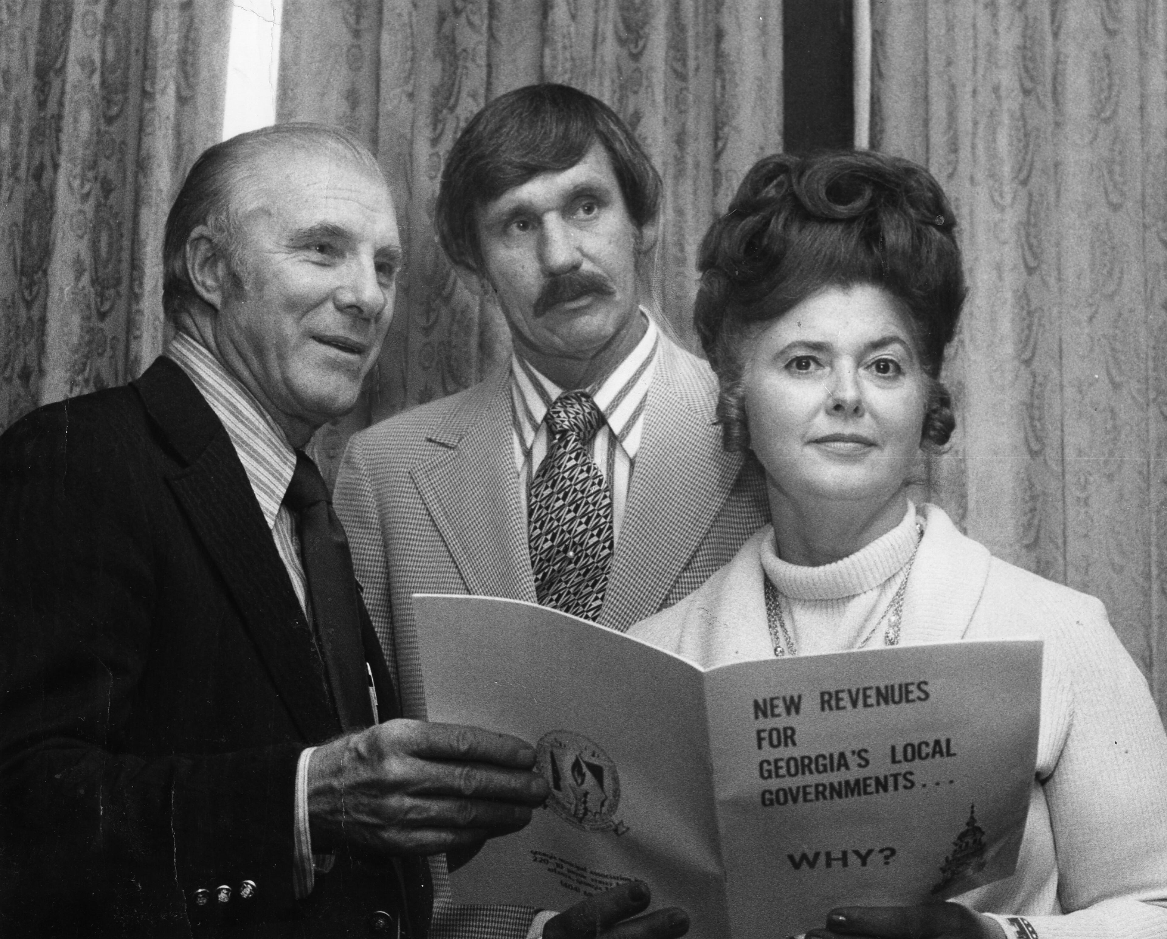 Known as "Miss Lillian," Webb became the first woman and first Republican to be elected to the Norcross City Council in 1969. Five years later, she was elected mayor. In this October 1973 photo, Webb confers with Elmer George (center) and Winder Mayor W.H. Harwell (left). Webb was still a Norcross city council member at the time. -- Text by Tyler Estep, AJC