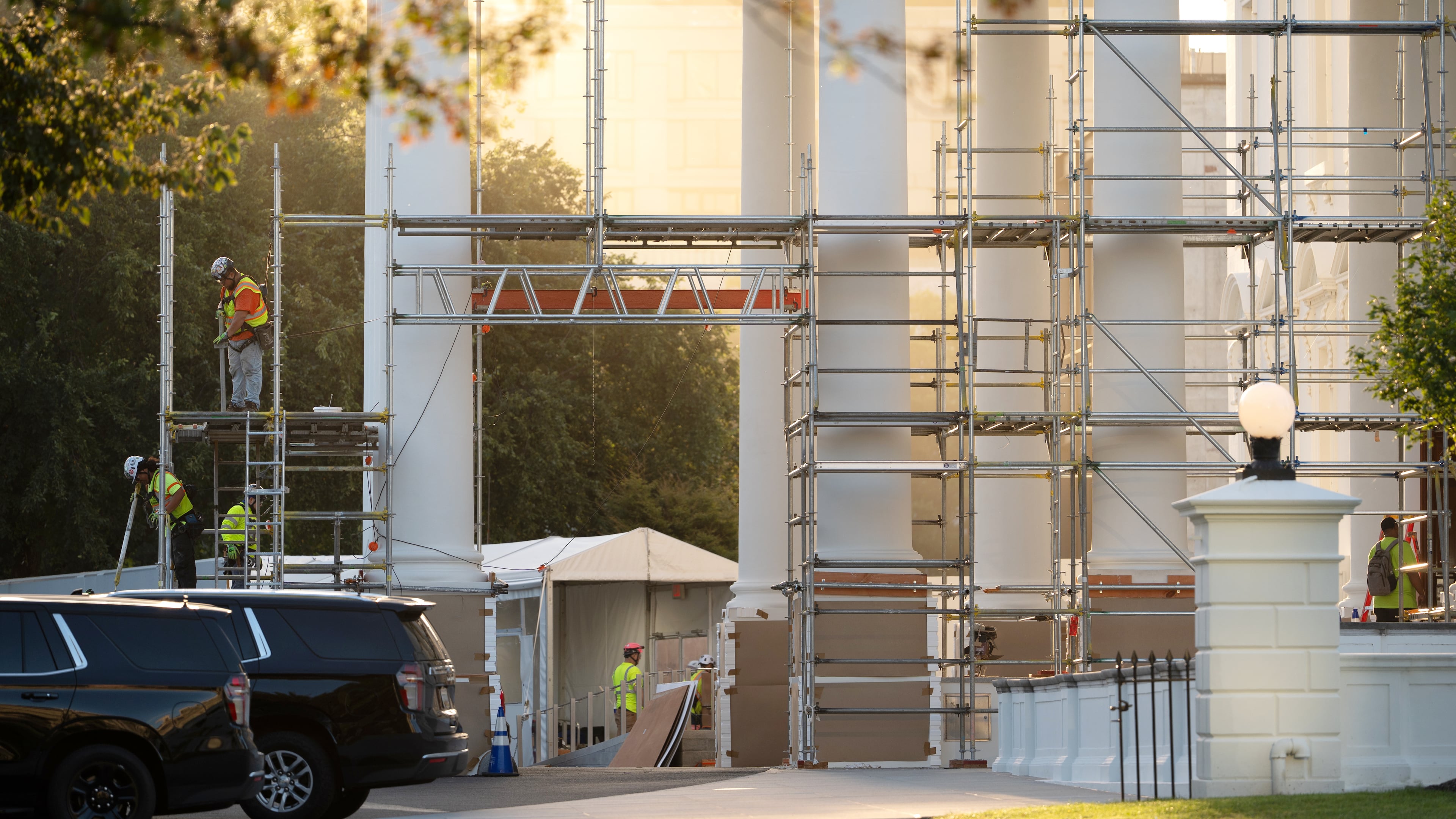 Workers remove scaffolding from columns at the North Portico of the White House, Tuesday, Sept. 8, 2026, in Washington. (AP Photo/Mark Schiefelbein)
