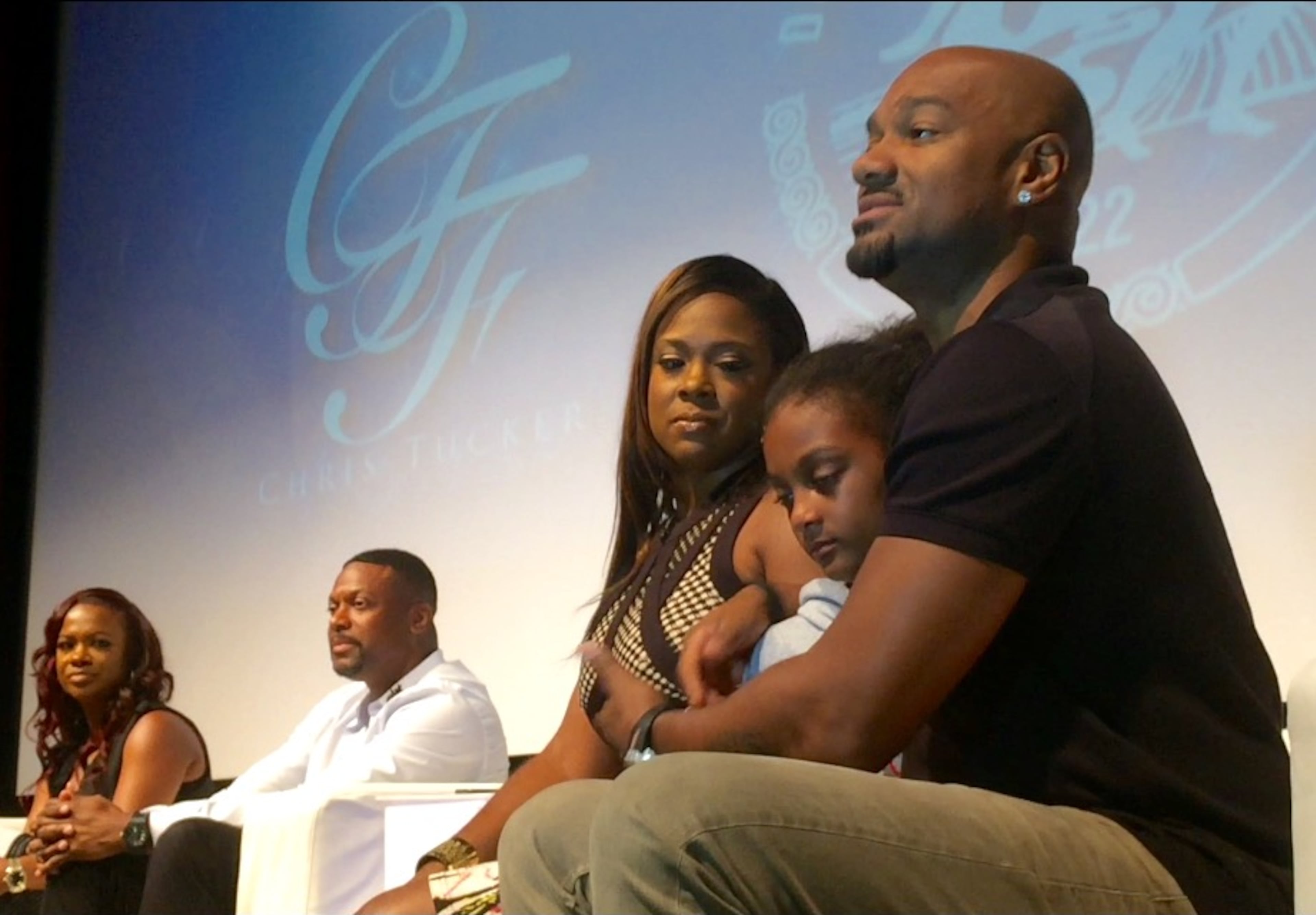 Jamison Shaw, 10, sits with Big Tigger after Chris Tucker invited her to join the panelists on stage. Photos: Jennifer Brett