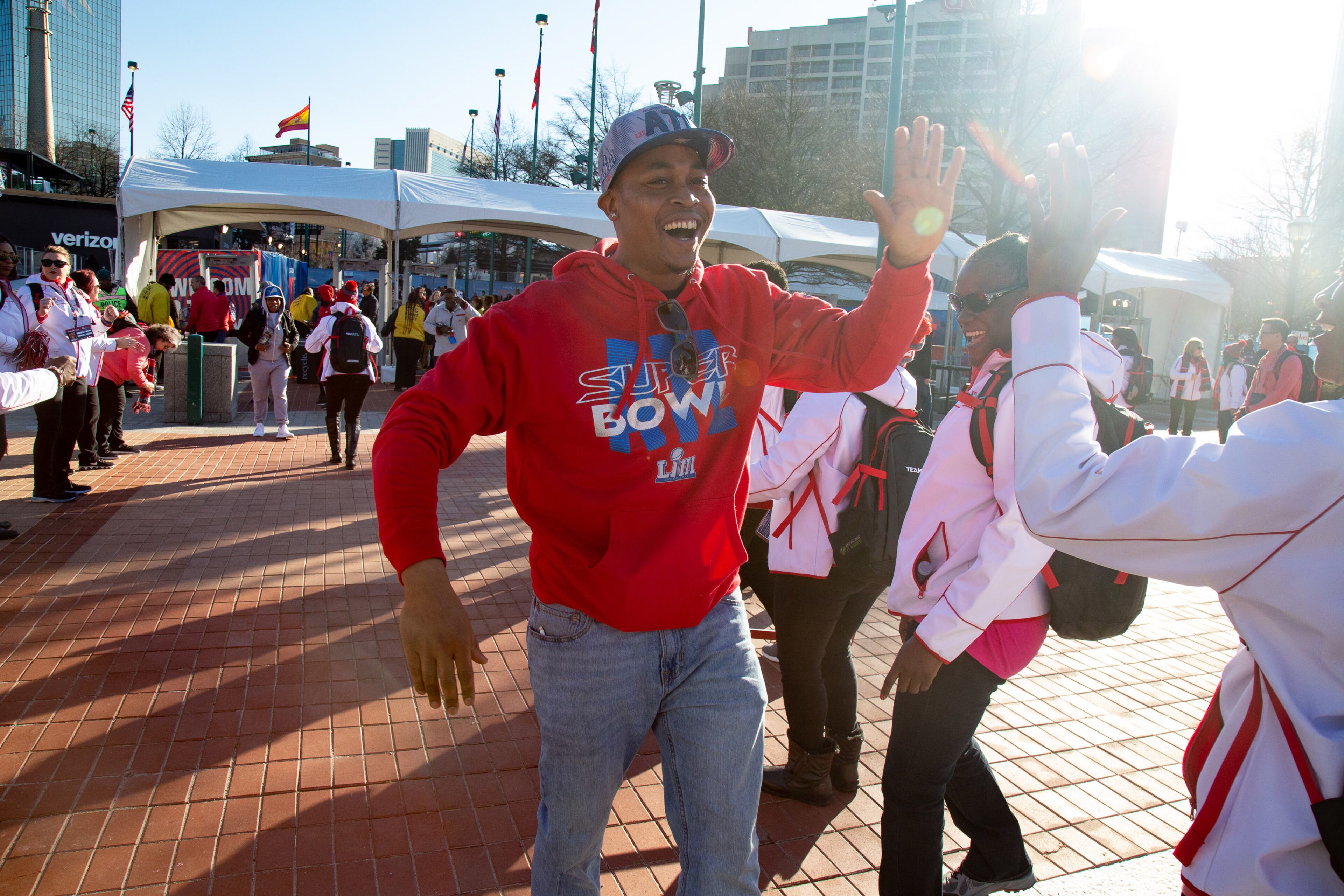 Benjamin Lowe is greeted by volunteers as he enters the Super Bowl LIVE presented by Verizon at the Centennial Olympic Park in downtown Atlanta January 31, 2019. STEVE SCHAEFER / SPECIAL TO THE AJC
