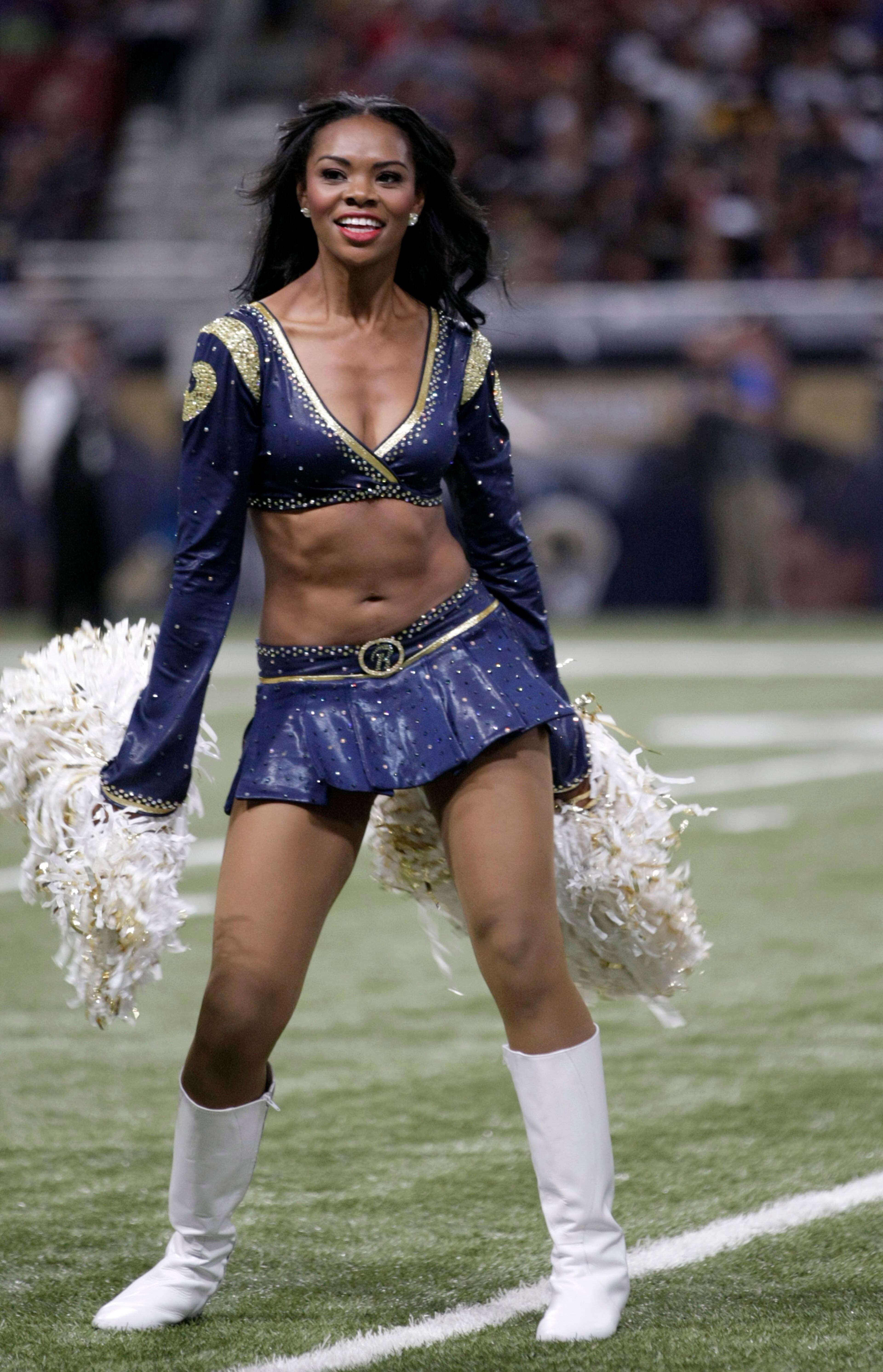 A St. Louis Rams cheerleader performs during the second quarter an NFL football game between the St. Louis Rams and the Minnesota Vikings Sunday, Sept. 7, 2014, in St. Louis. (AP Photo/Tom Gannam)