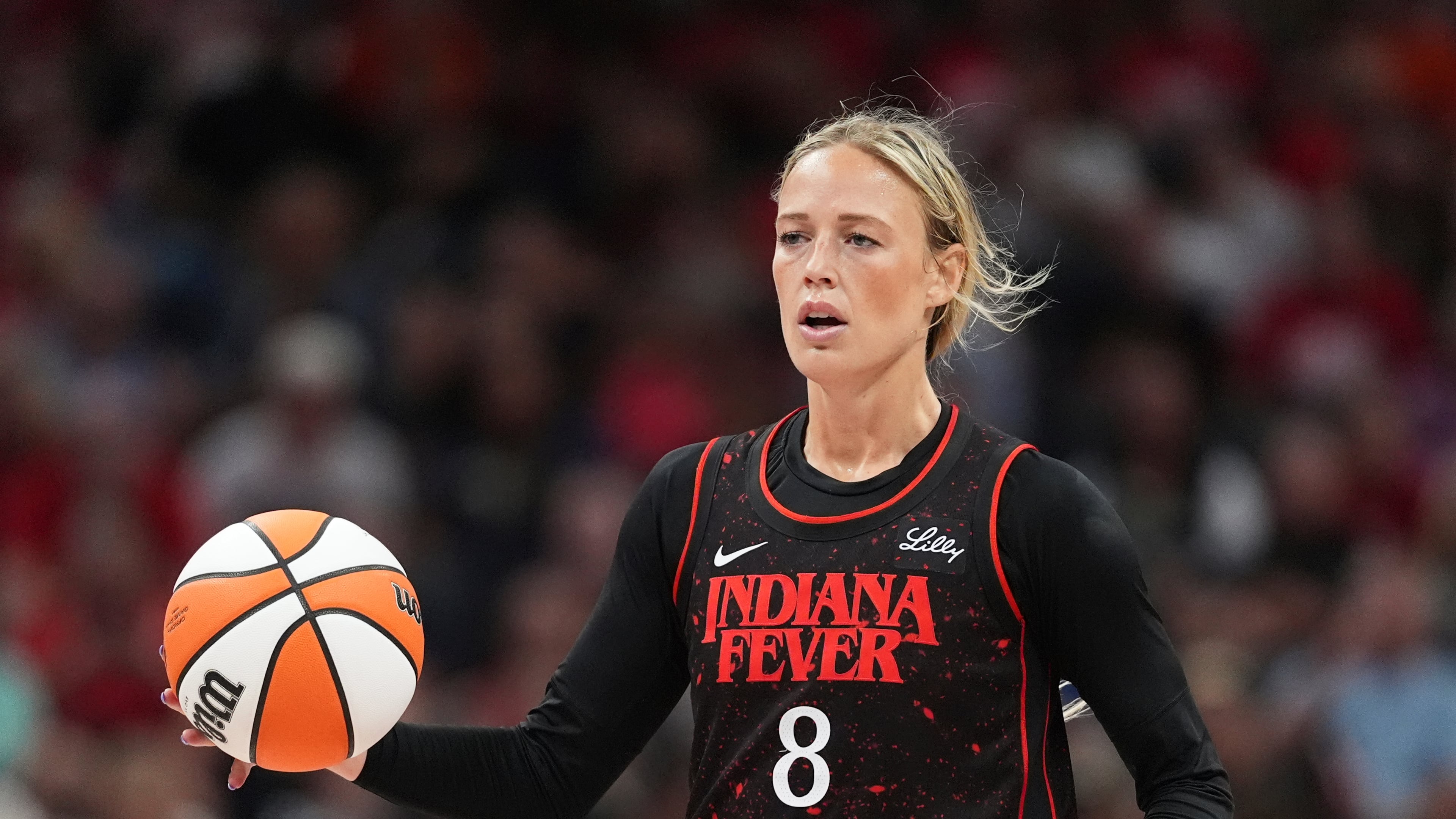 FILE - Indiana Fever guard Sophie Cunningham (8) plays against the Dallas Wings in the second half of a WNBA basketball game in Indianapolis, Aug. 12, 2025. (AP Photo/Michael Conroy, File)
