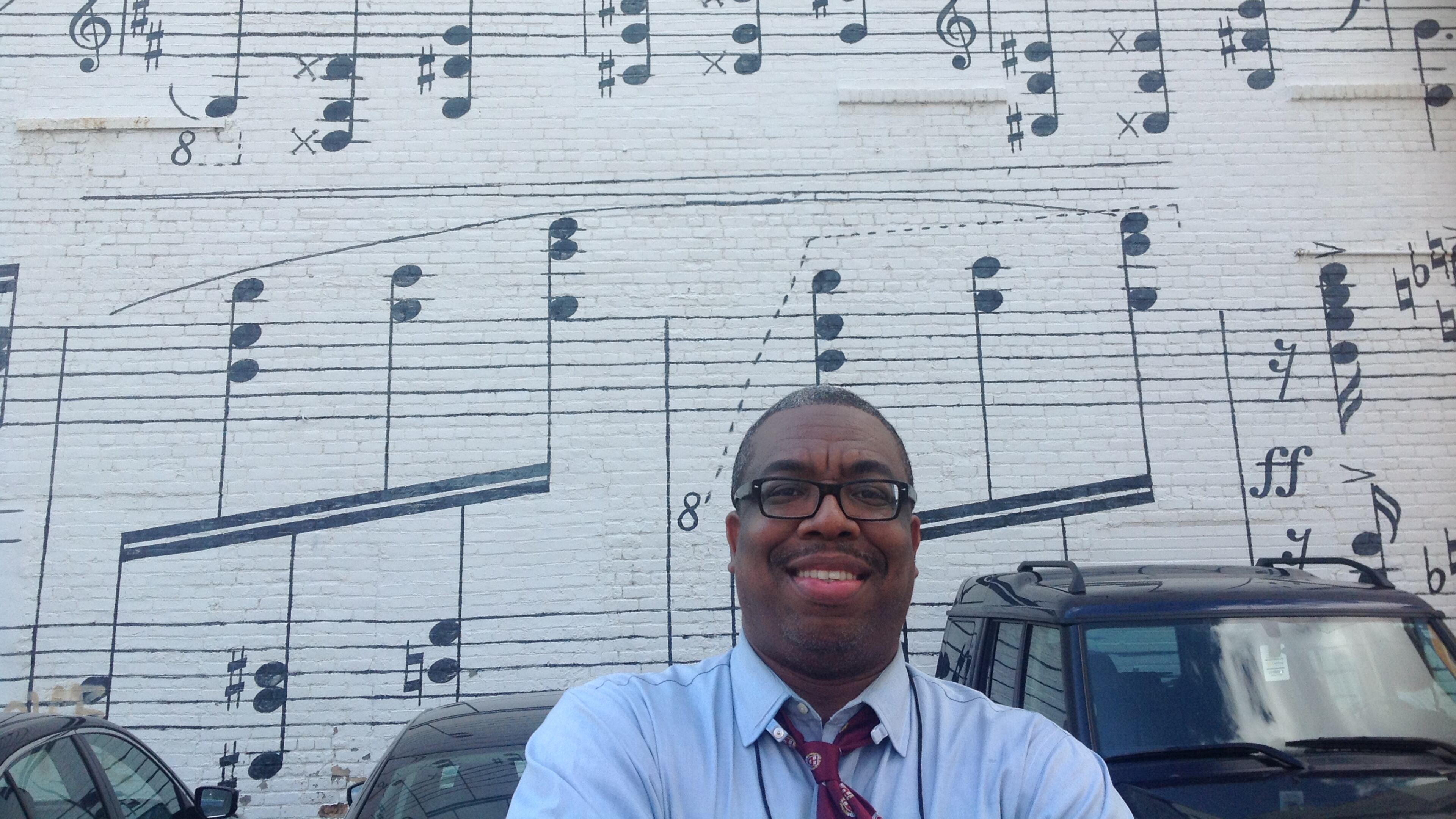The author in front of the famous Schmitt Music mural in downtown Minneapolis. In 1977, photographer Robert Whitman took a series of the then-17-year-old Prince.