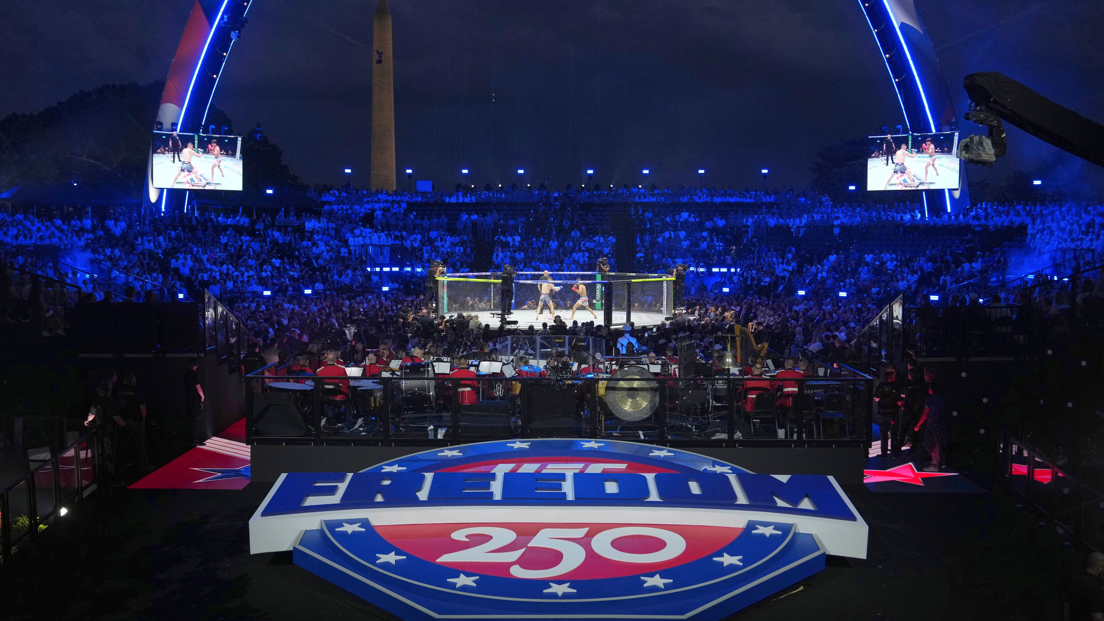 Featherweight fighters Diego Lopez and Steve Garcia in the ring during the first fight at UFC Freedom 250 on the South Lawn of the White House, Sunday, June 14, 2026, in Washington. (AP Photo/Julia Demaree Nikhinson)